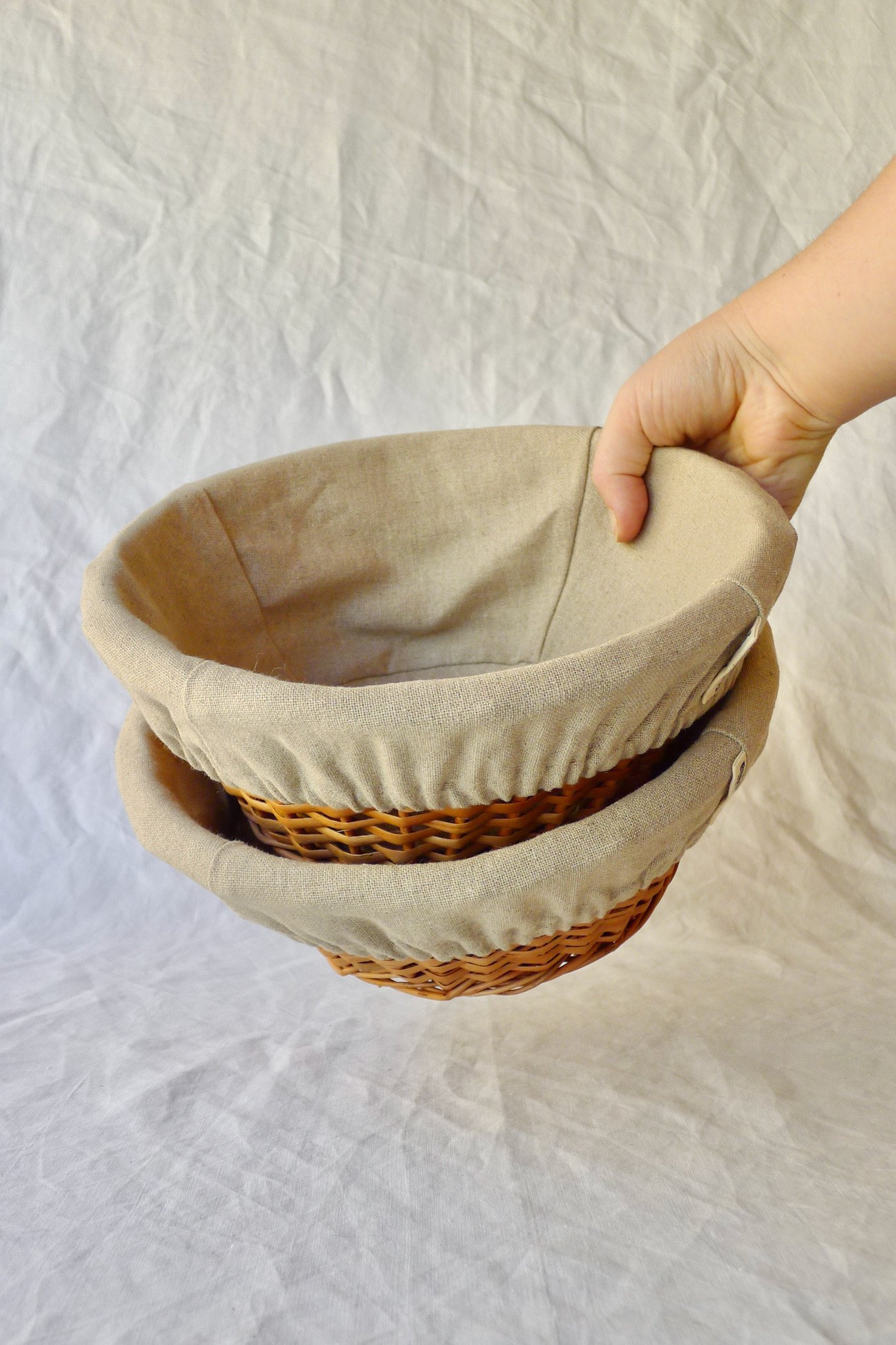 Two linen-lined wicker bannetons