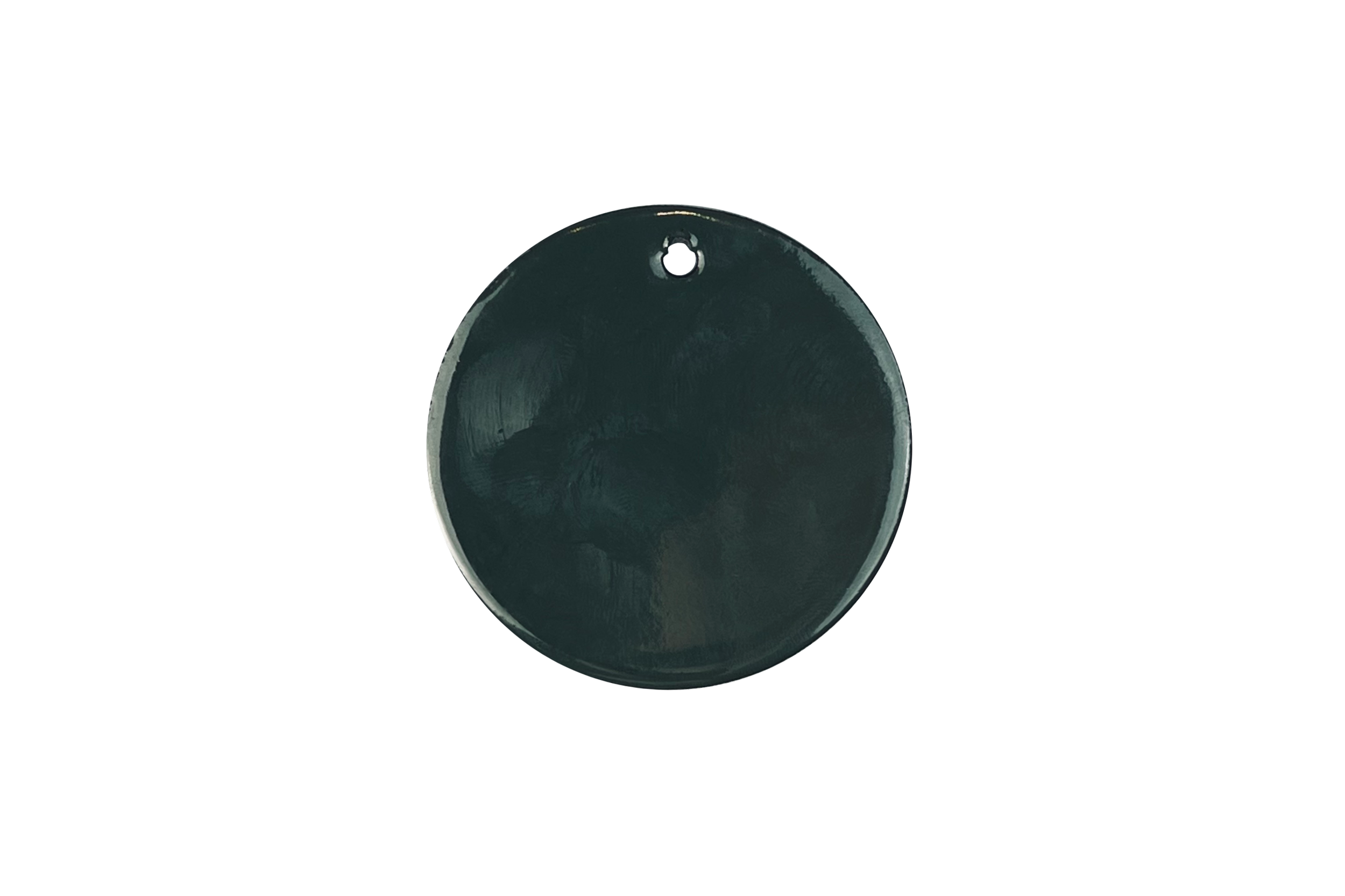 A black metal can with a pull tab on top, placed against a dark background.