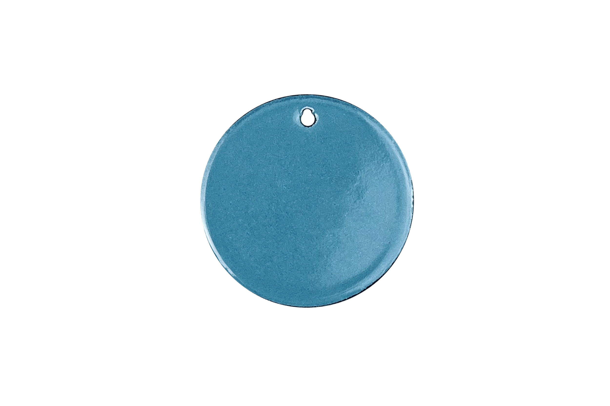 A turquoise-blue round enamel sample with a hole on top against a black background.