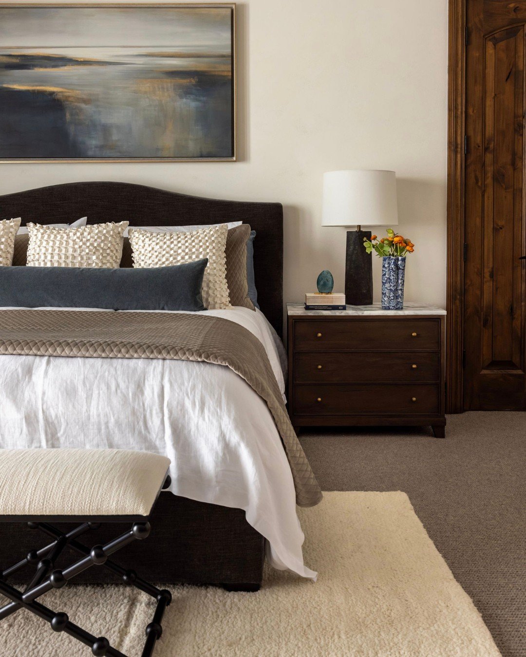 Neoclassic Revival is a beautiful exercise in duality, honoring the home's original, rustic character while ushering the interiors into a modern new era. ⁠
⁠
In the primary suite, we honored the warmth and character of the room's original woodwork, b
