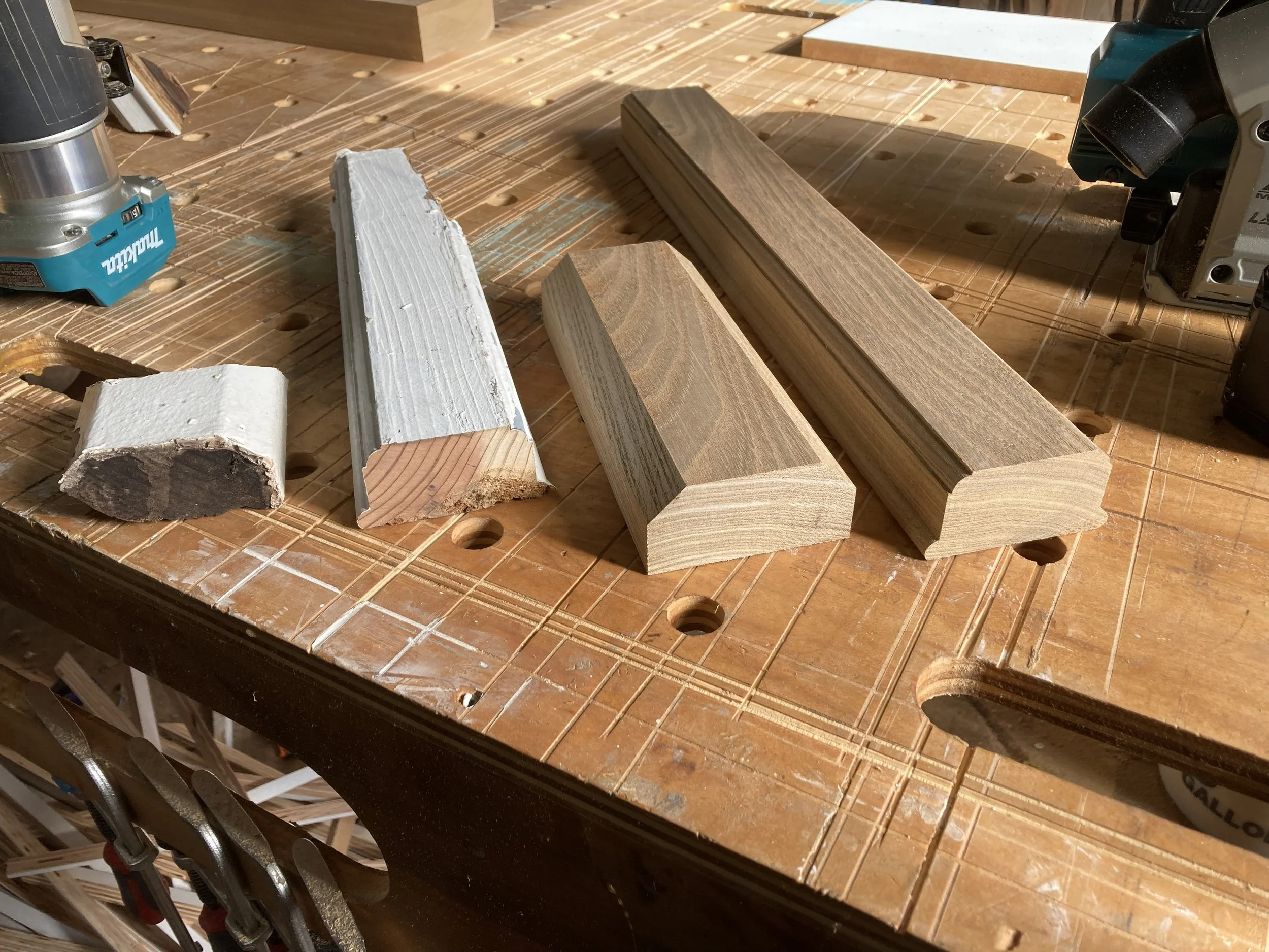 Woodworking workbench with wooden moldings and router
