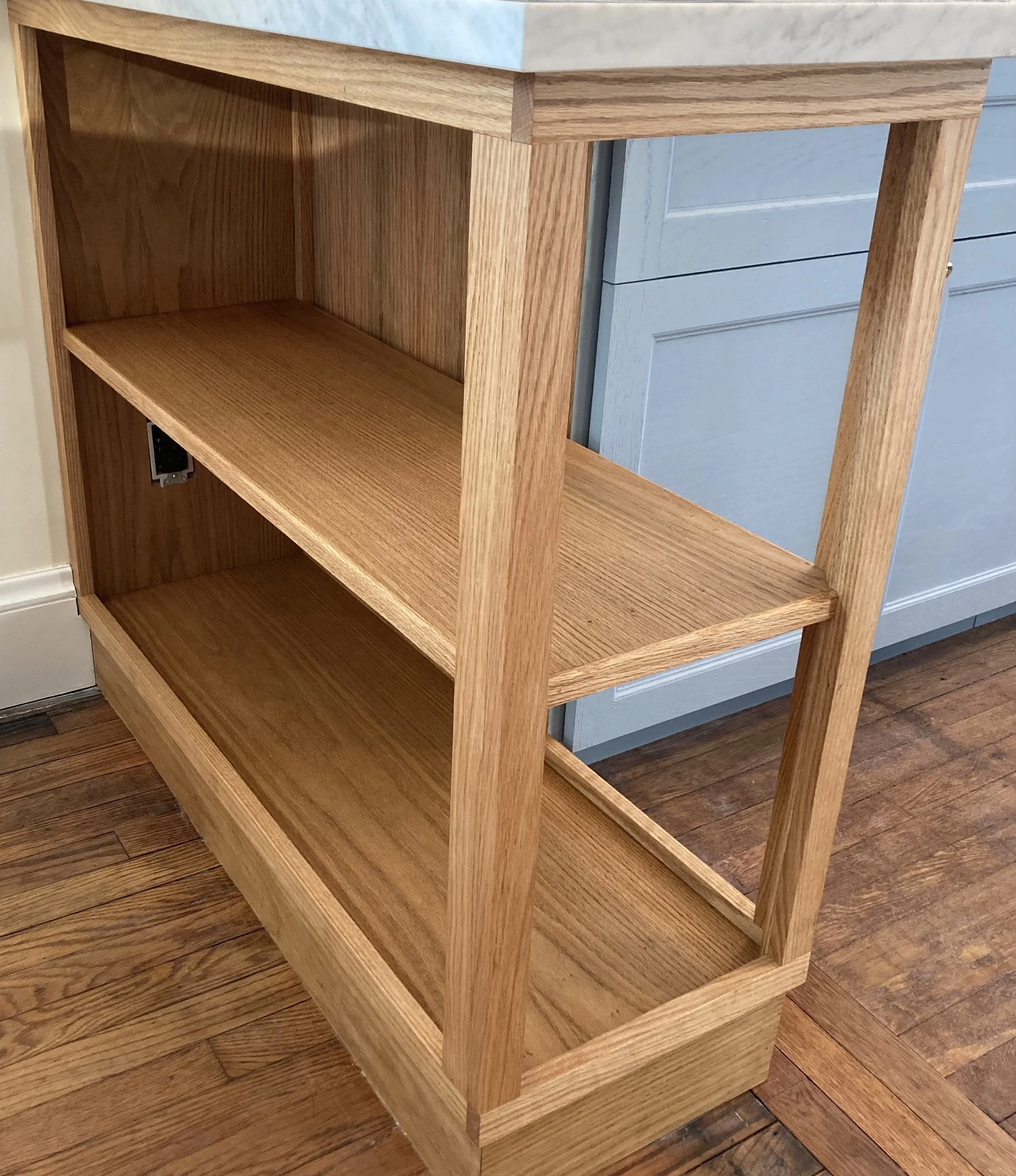 Wooden kitchen shelf with two levels and a marble countertop