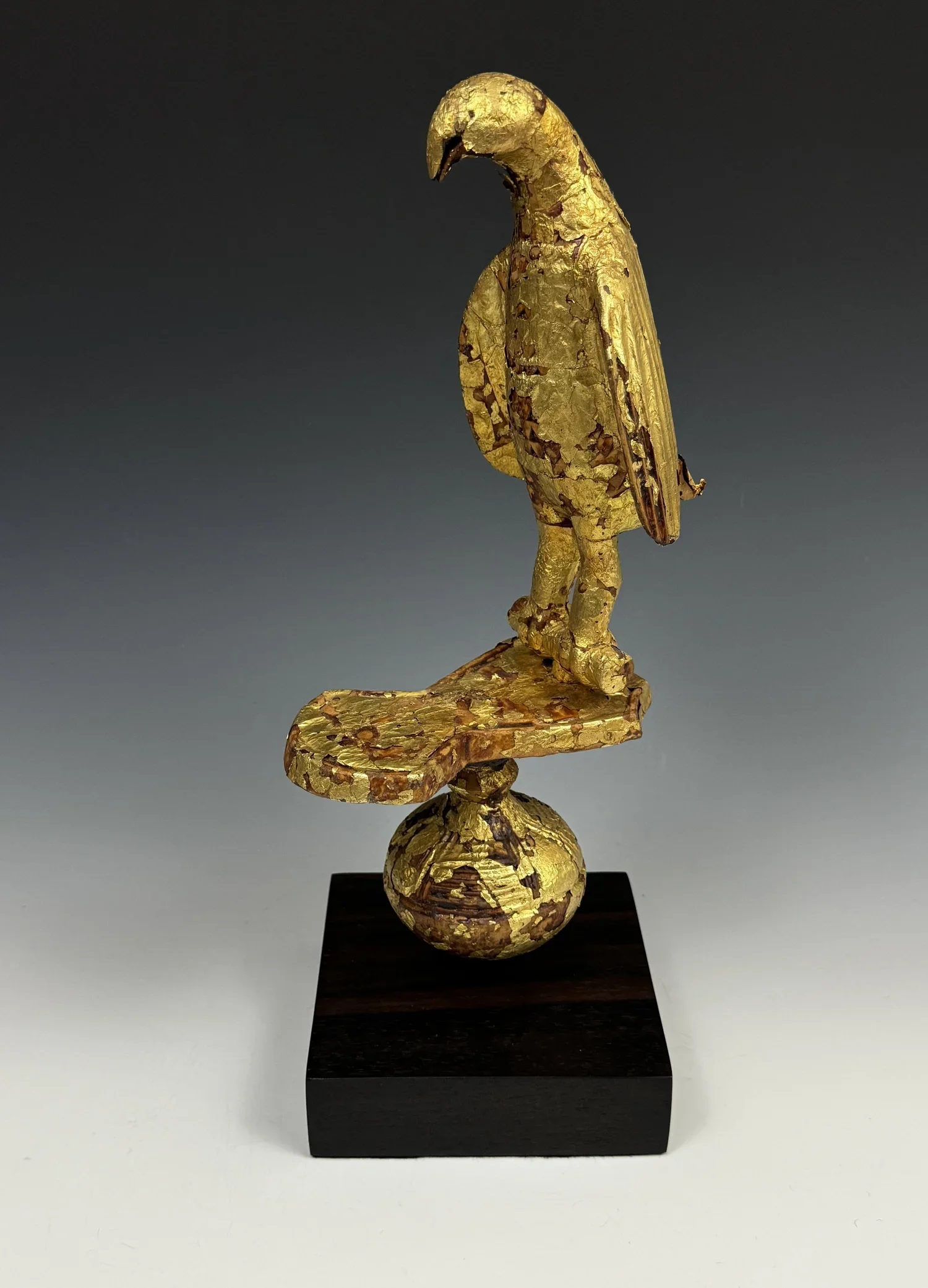 I believe this represents a vulture or “Opete”. There are many Asante proverbs associated with the vulture and it also symbolizes self-begetting, self-creation, and self-birth. It is the animal that symbolizes Odomankoma, the Akan deity who created t