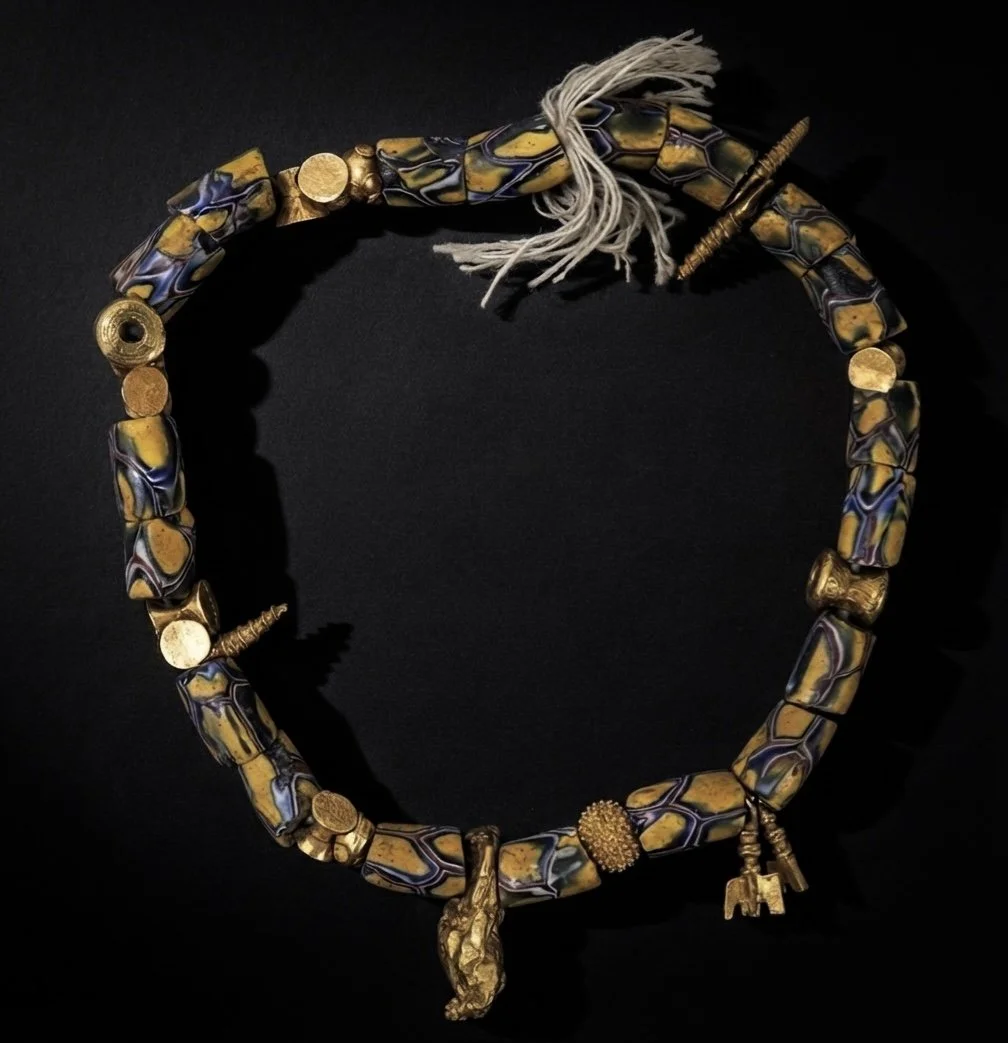 An exceptional Akan bracelet constructed of glass millefiori beads and Akan high karat gold beads. Ghana, West Africa, 19th-20th c.
The Akan cast gold bead imagery include spiraled sea shells, a rare large, natural placer gold nugget, drum shaped bea
