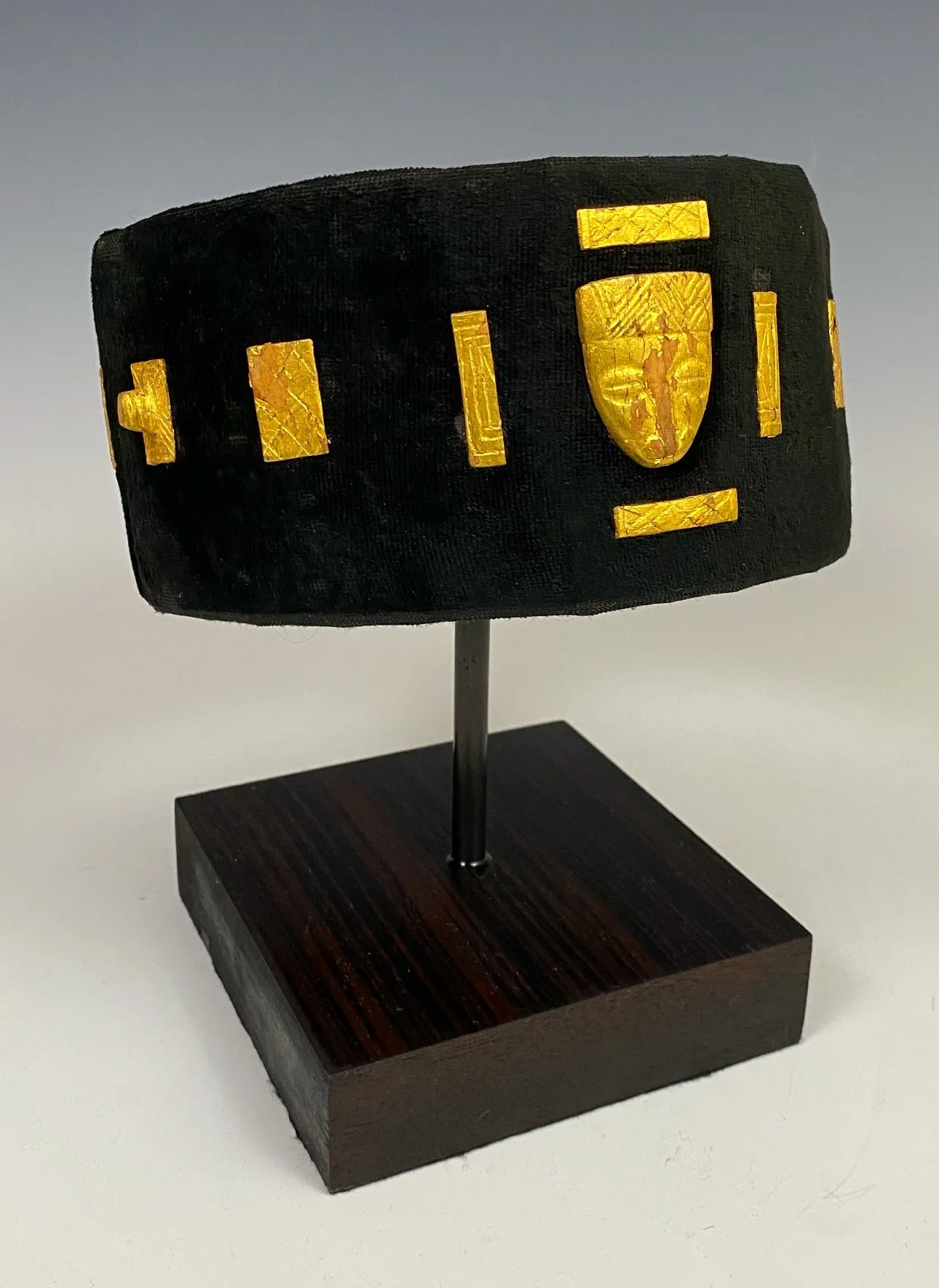 A Baule or Akan (Baoulé) “abotire” chief/dignitary’s head band—felt, fabric, wood, gold foil. Côte d’Ivoire.