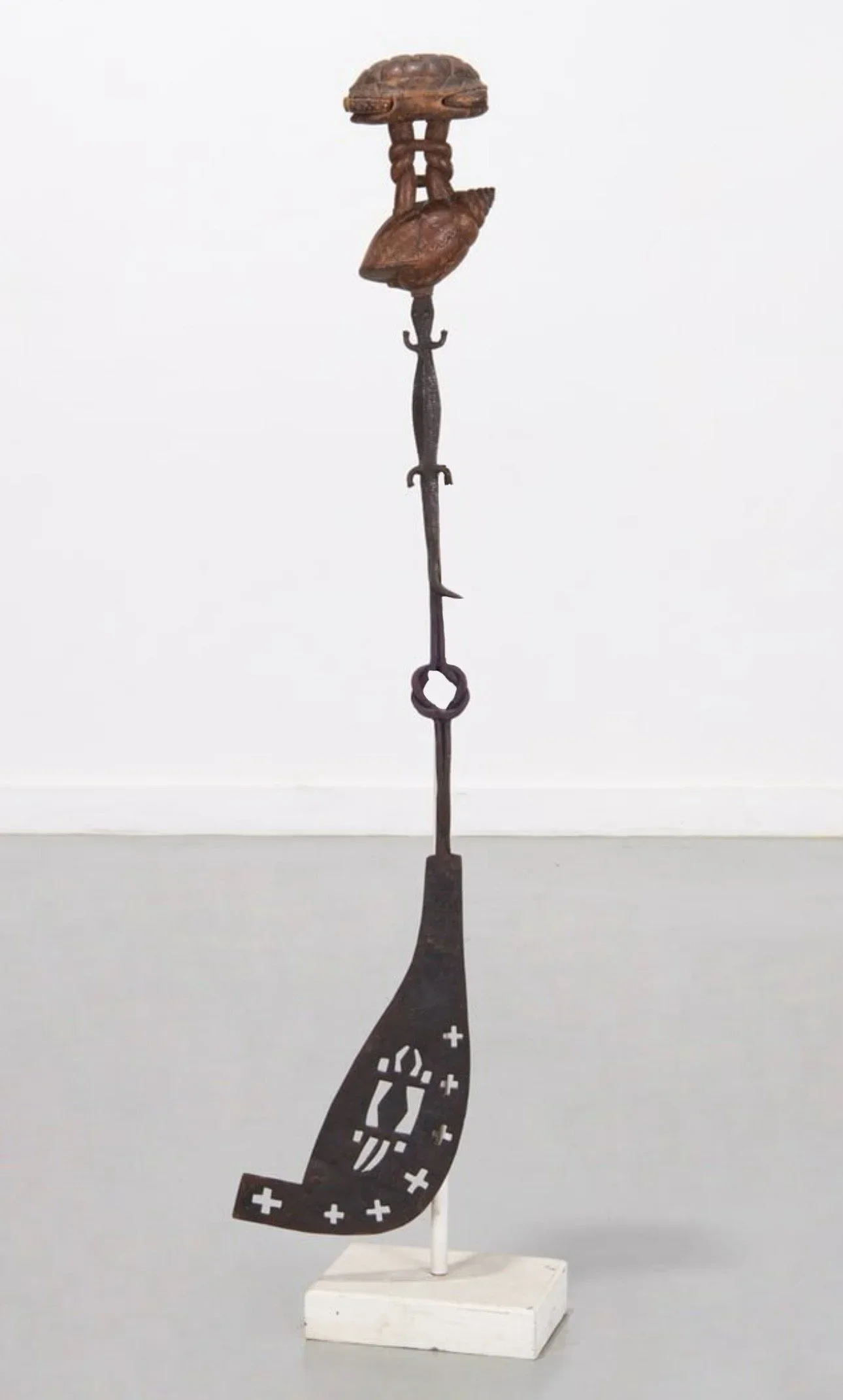 Akan state swords like this one are more ceremonial and symbolic of an instrument of power and are always carried by the “blade”. The sword blade here depicts imagery of wisdom knots, crocodiles, and other Akan symbols. The sculptural hilt is a highl