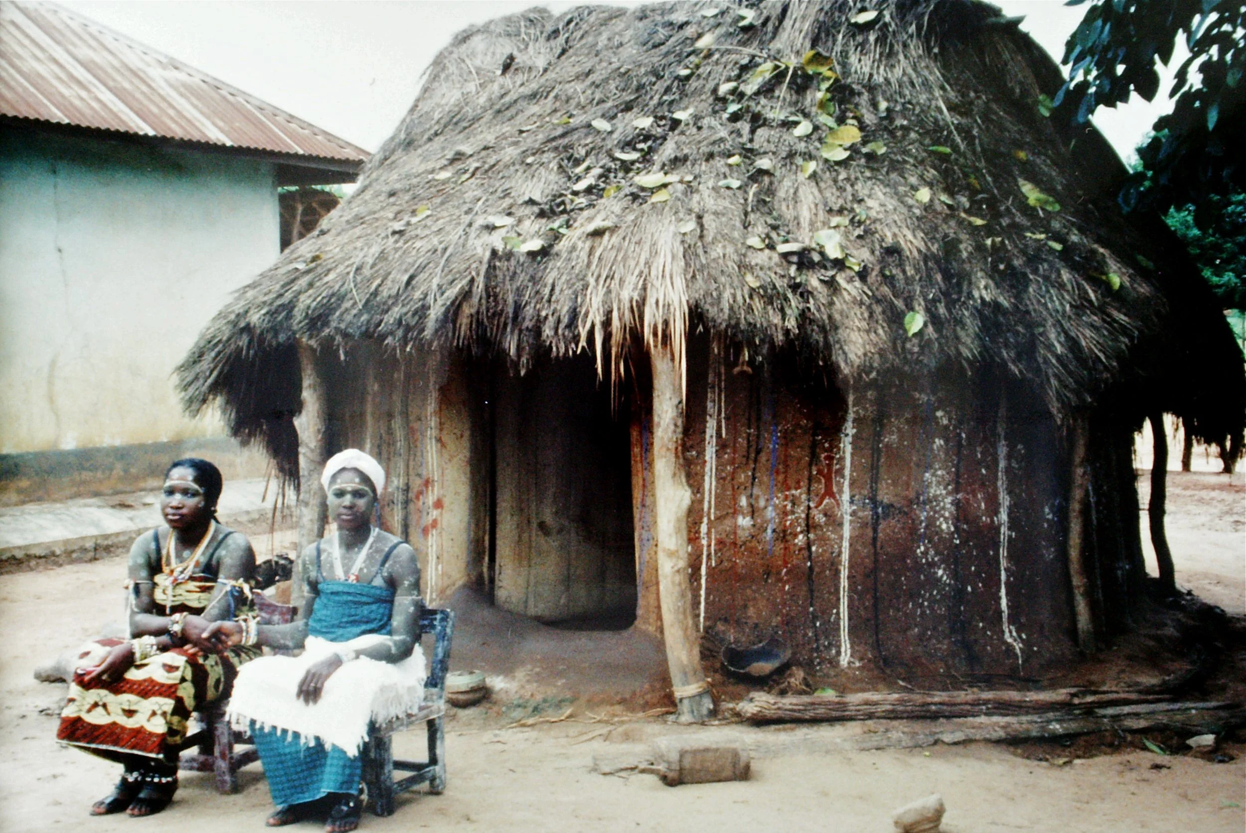 A rare female féticheur and her female apprentise in the village of Essikro, Côte d'Ivoire, 1999
