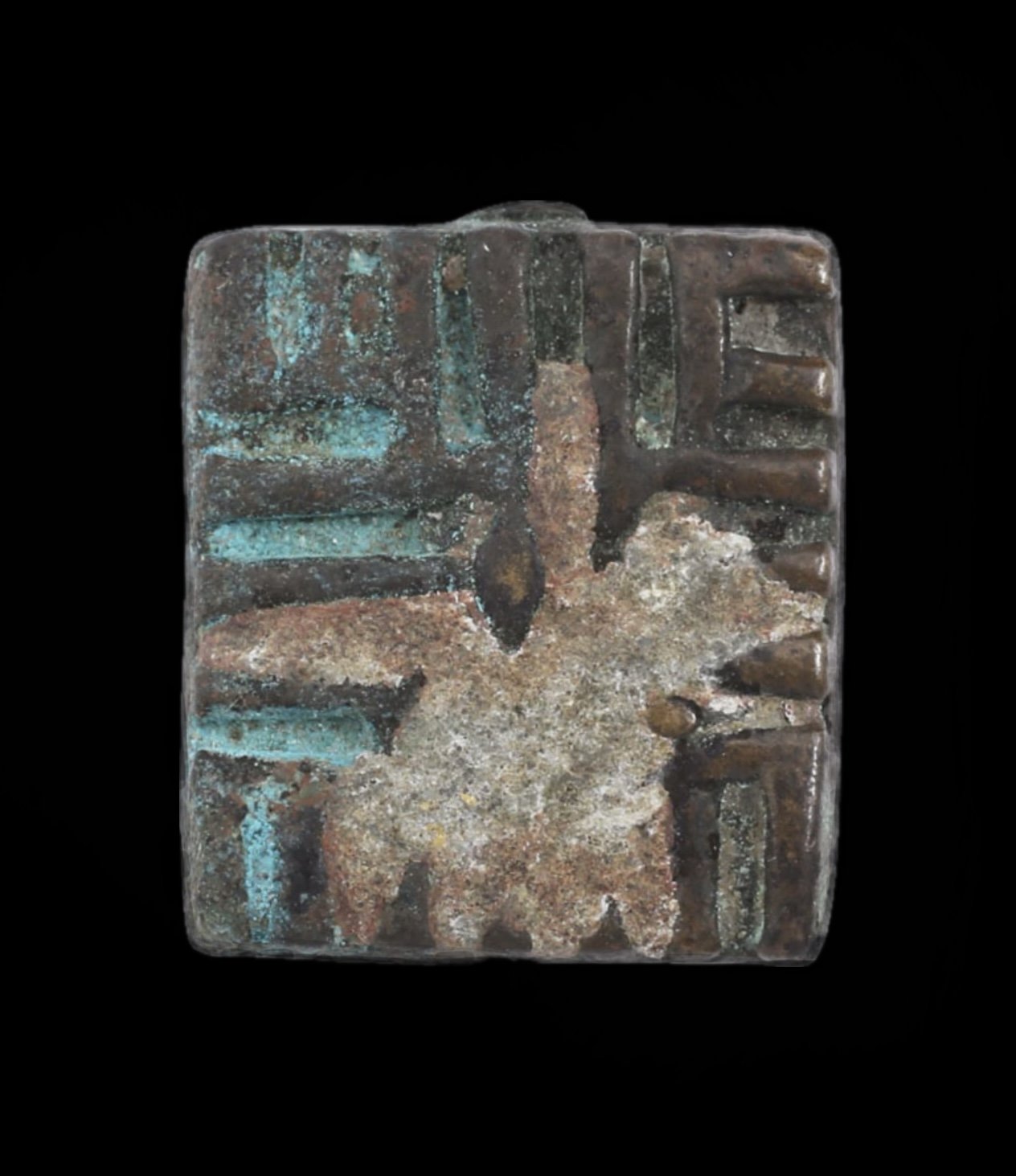 An Akan copper alloy gold weight with a geometric line pattern and heavy patina. Lead was added to the surface for weight correction,  .5" x .5". Ghana. Ex Sir Cecil Armitage Collection, dating to the second half of the 19th century to early 20th. Si