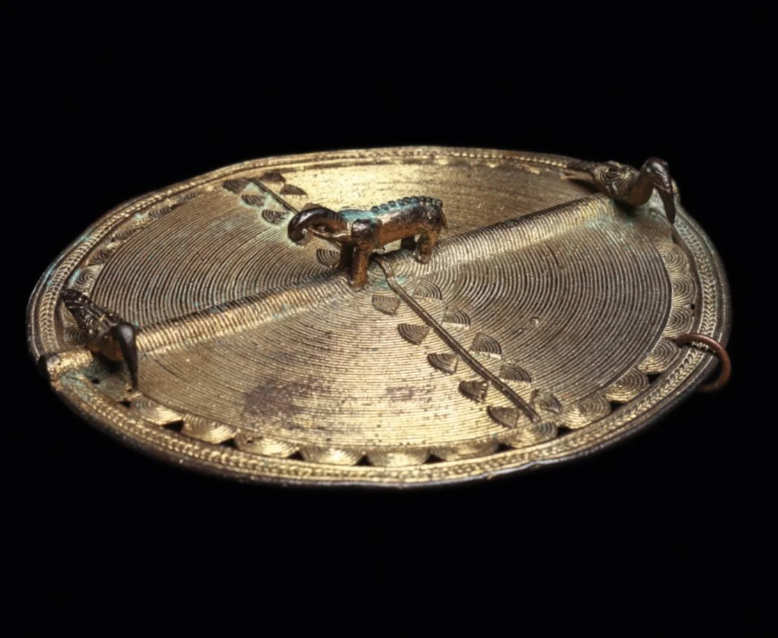 An Akan or Baule gilded copper alloy pendant with two birds and an elephant. 3.5” dia. Côte d’Ivoire, Ghana. EX Paul Tishman collection (NY) by decent. “Paul Tishman was often asked why he and his wife Ruth decided to collect African art. His simple 