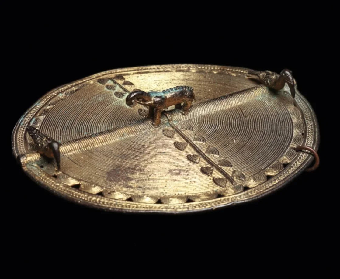 An Akan or Baule gilded copper alloy pendant with two birds and an elephant. 3.5” dia. Côte d’Ivoire, Ghana. EX Paul Tishman collection (NY) by decent. “Paul Tishman was often asked why he and his wife Ruth decided to collect African art. His simple