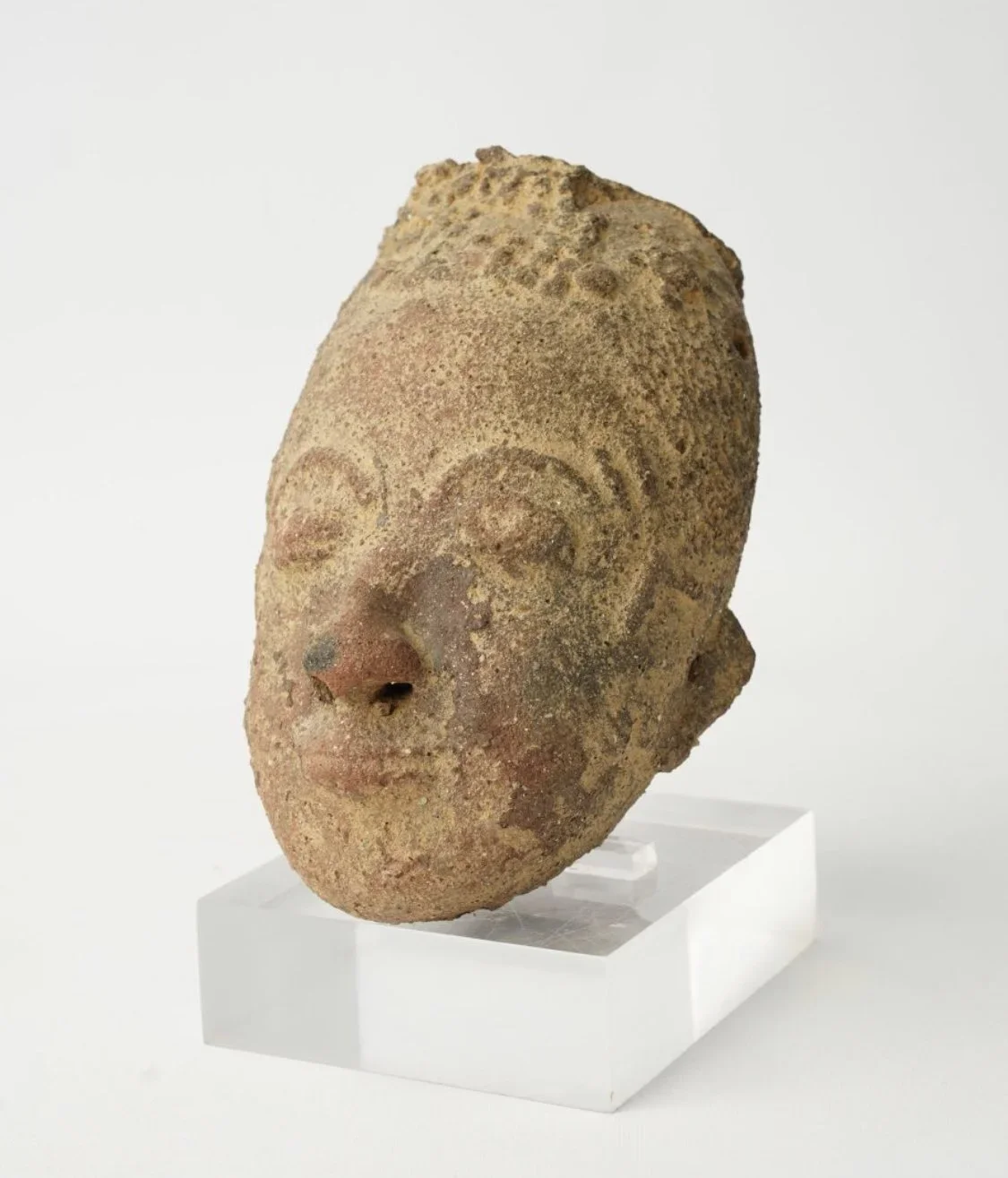 Akan-Twi memorial head "Nsodie", Ghana. Terracotta (partial missing sections). Height 6.25 in. Ex Robert and Nancy Nooter Collection, Washington, D.C.