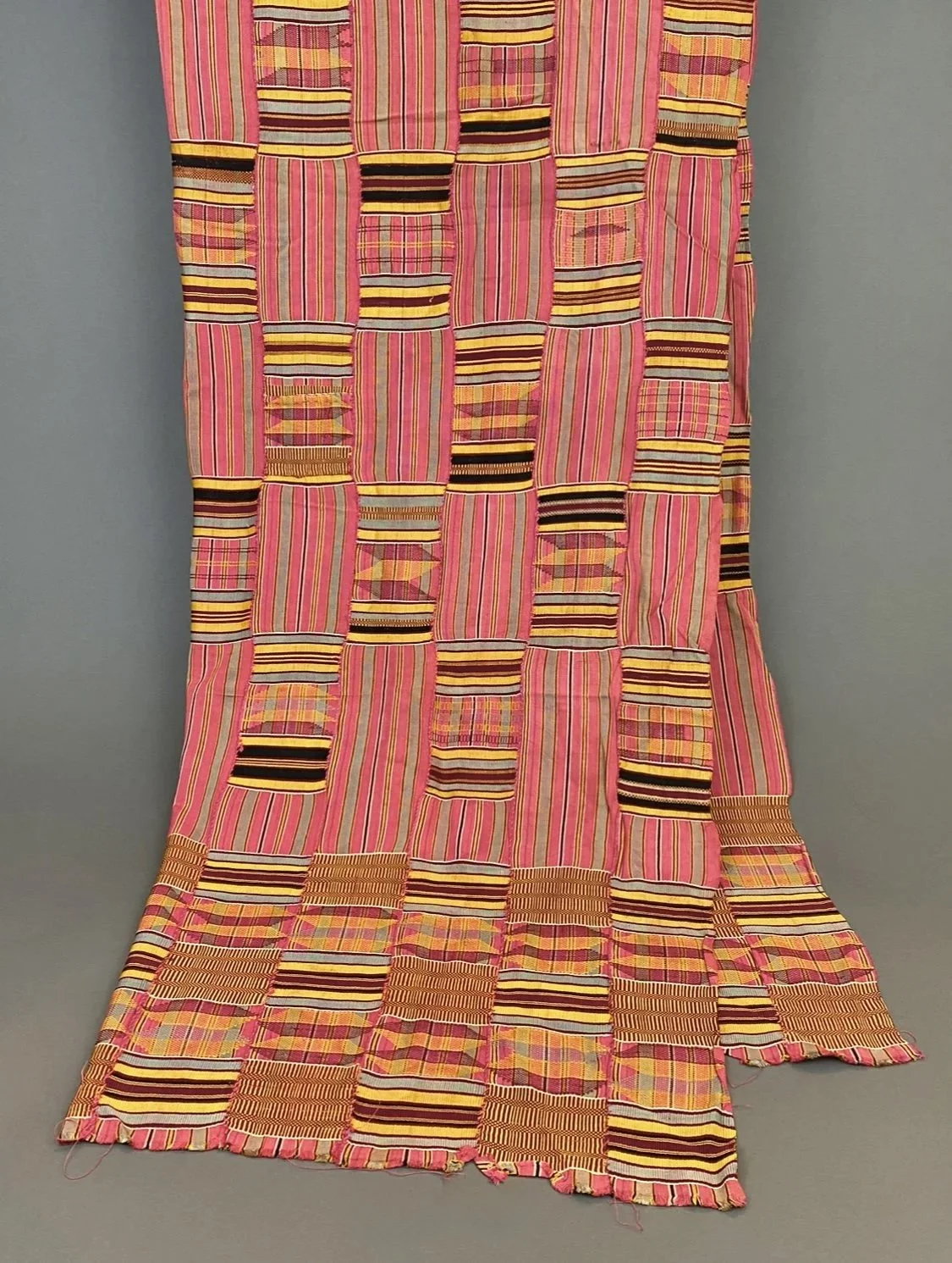 Ewe, Togo, vintage Kente woven silk and cotton textile, with multicolor stripe and check patterns sewn together, each panel 3"W, 74"L x 43".  Provenance:  Estate of professor Philip Gould, New York