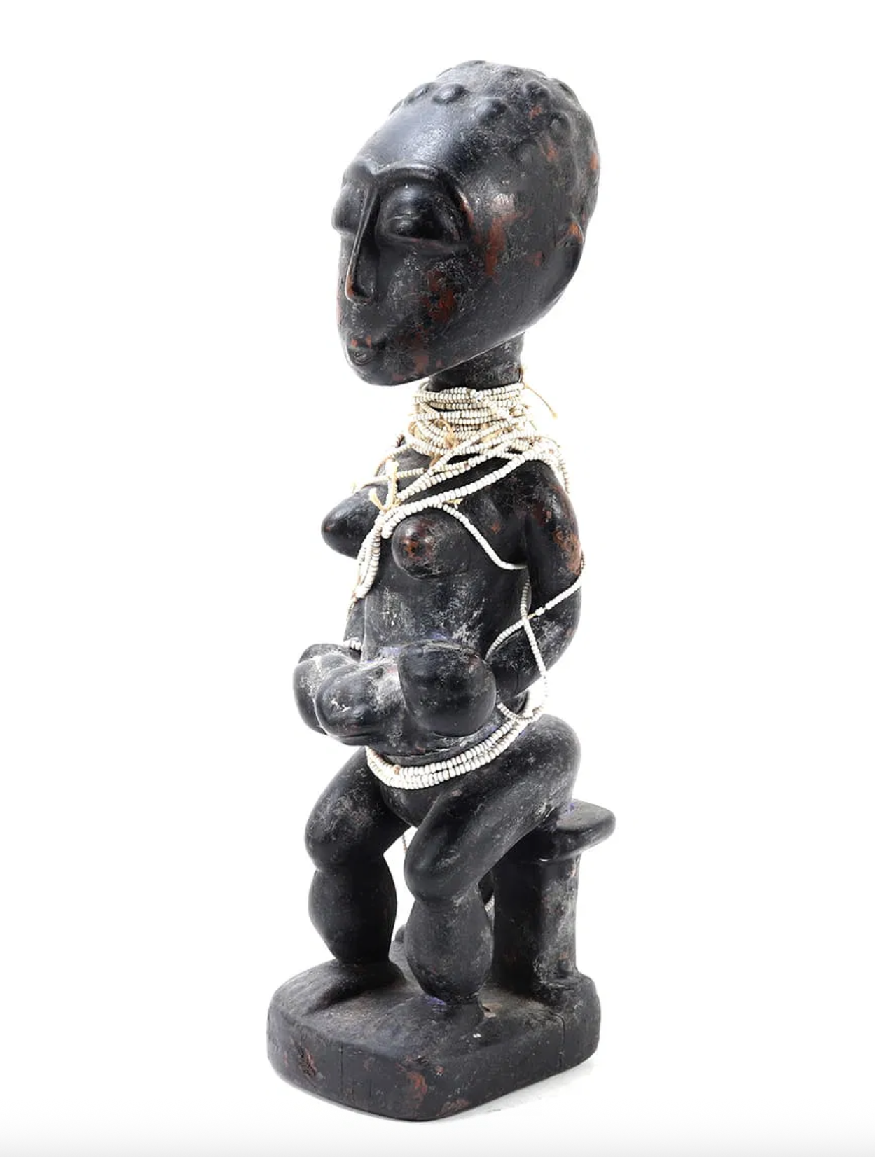 An Abron (Akan) maternity figure. Ghana. 17.5" H. Carved wood, brass tacks, pigment, glass beads. Abron maternity figures are relatively rare in comparison to the neighboring Baule in Côte d'Ivoire.  EX collection of Dr. Arikana Chihombori-Quao and D