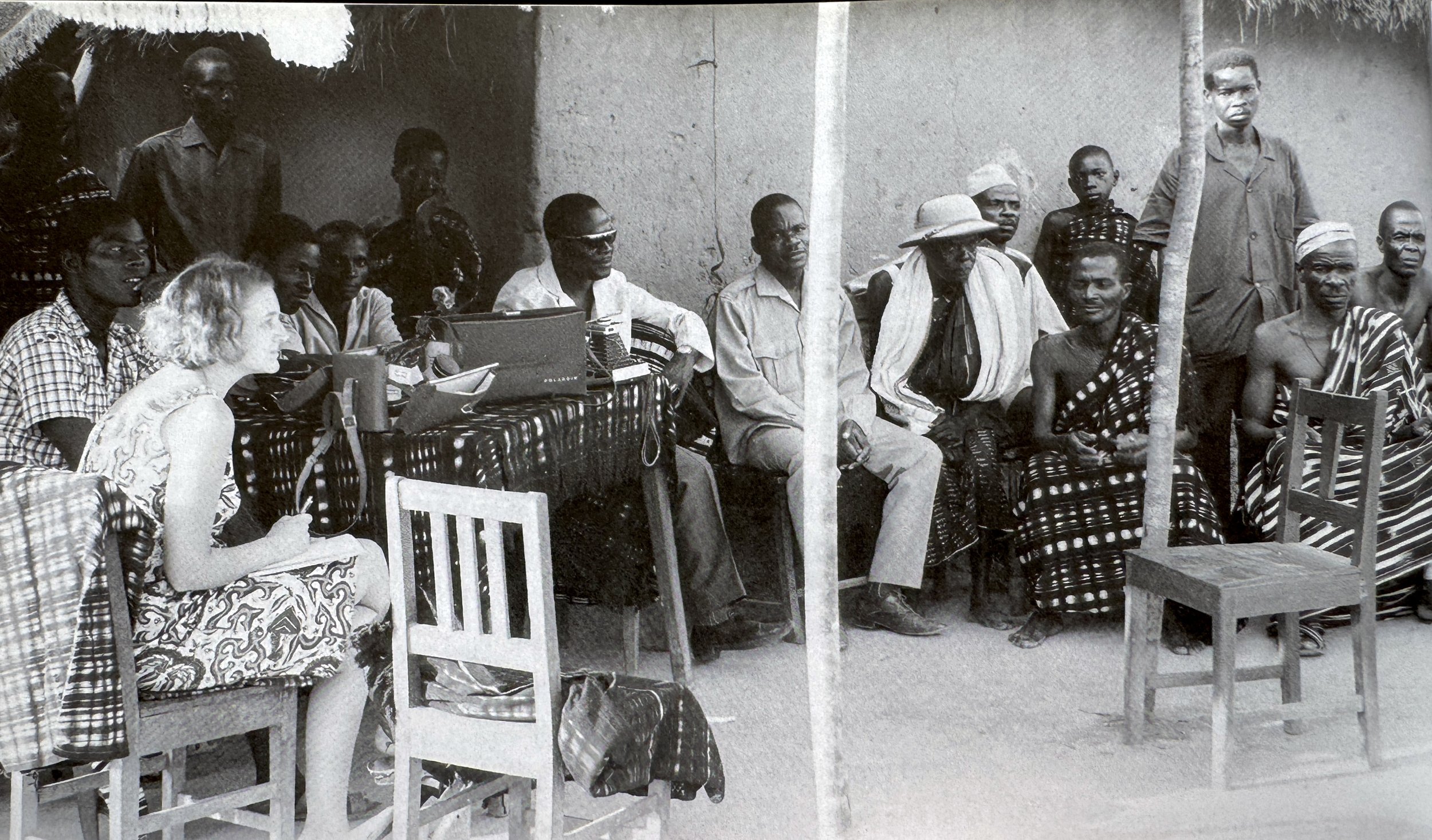 Denise David during field research in Didiévi. ca 1964. (Gallery Walu, Baulé publication, Basel, Switzerland).  Note: A  Baulé chief wearing a pith helmet.