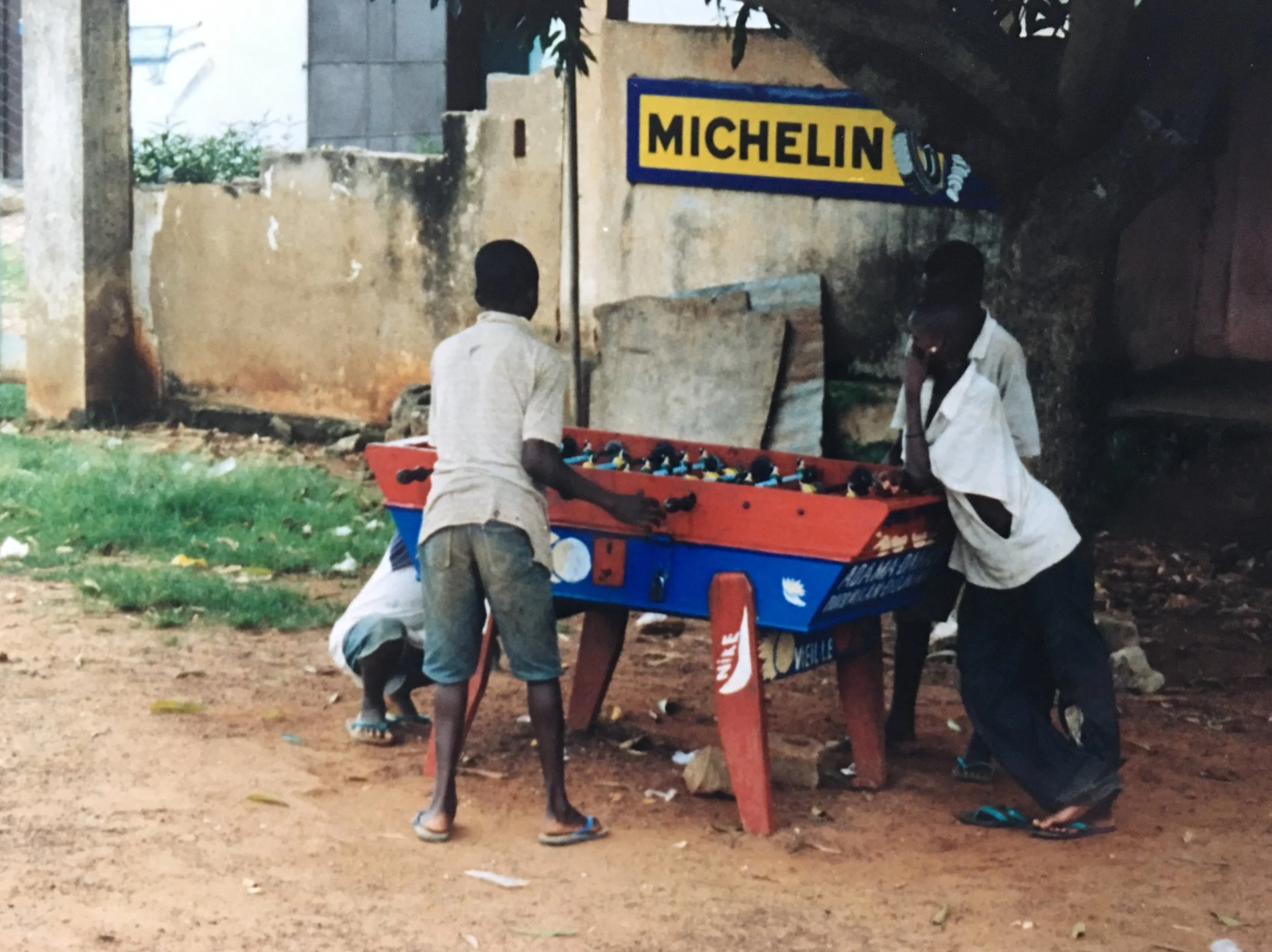 Kids playing table soccer, Mali 2003.  You can find one of these in most larger towns in Mali, 2003.