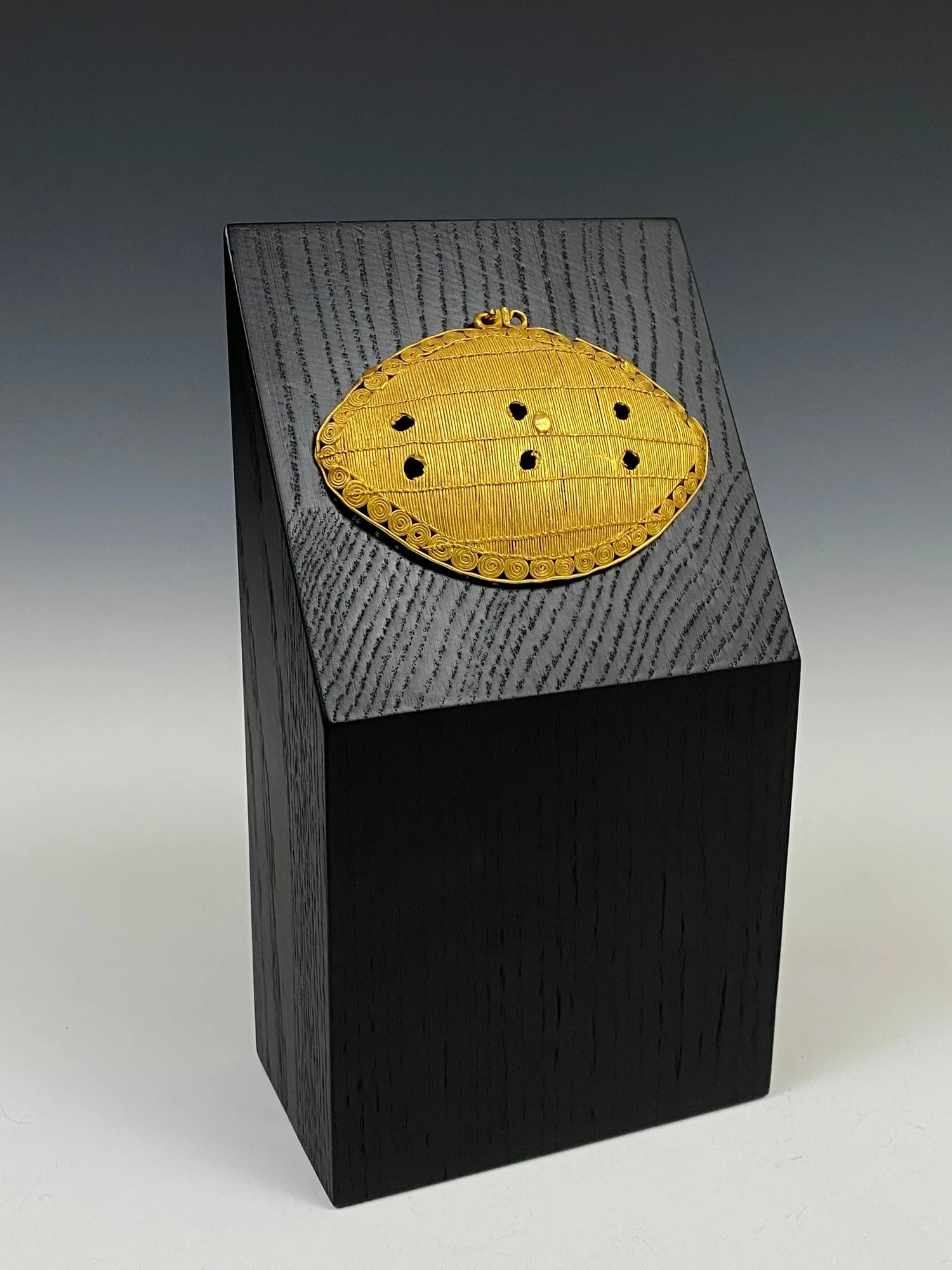 Akan cast gold alloy pendant in the form of an abstract beetle or possibly the lozenge-shaped traditional design called “kontro bie” or "female crab" by the Ebrie, Côte d’Ivoire. H 5.9 cm. W 8.9 cm. Published: Lüthi, Werner & David, Jean (2009). Exhi