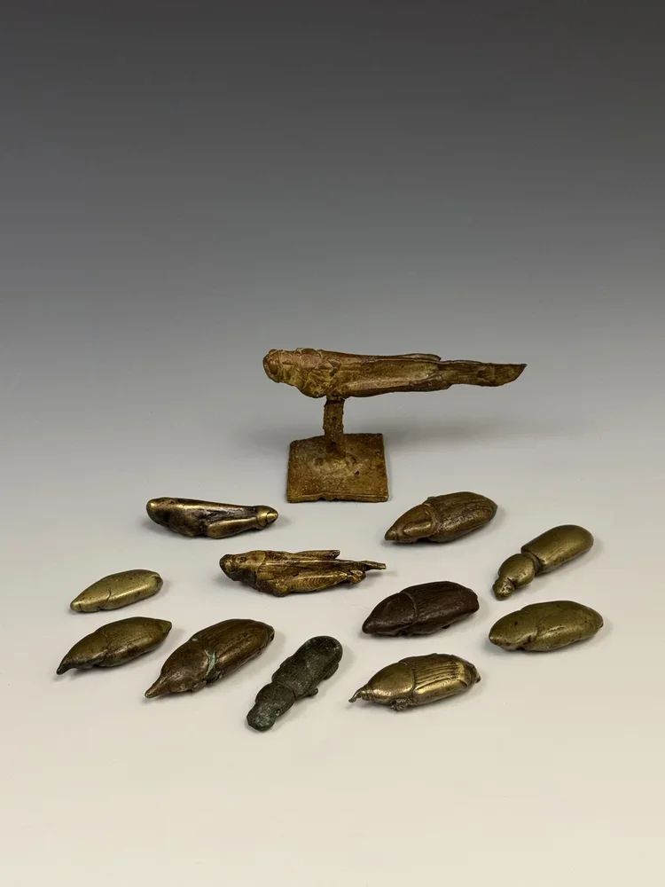 Akan cast copper alloy gold weights. All the insects (beetles and locust) were cast from nature meaning that the dried, dead insect was directly moulded and heated until the insect's body burned away completely, leaving the hollow mould to then pour