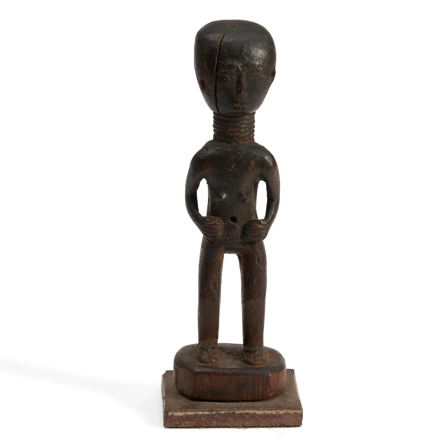 n Akan female figure, standing on a round base, wearing sandals. Ghana. H 11.5 inches. EX Bonhams, Ex private collection Long Island, New York