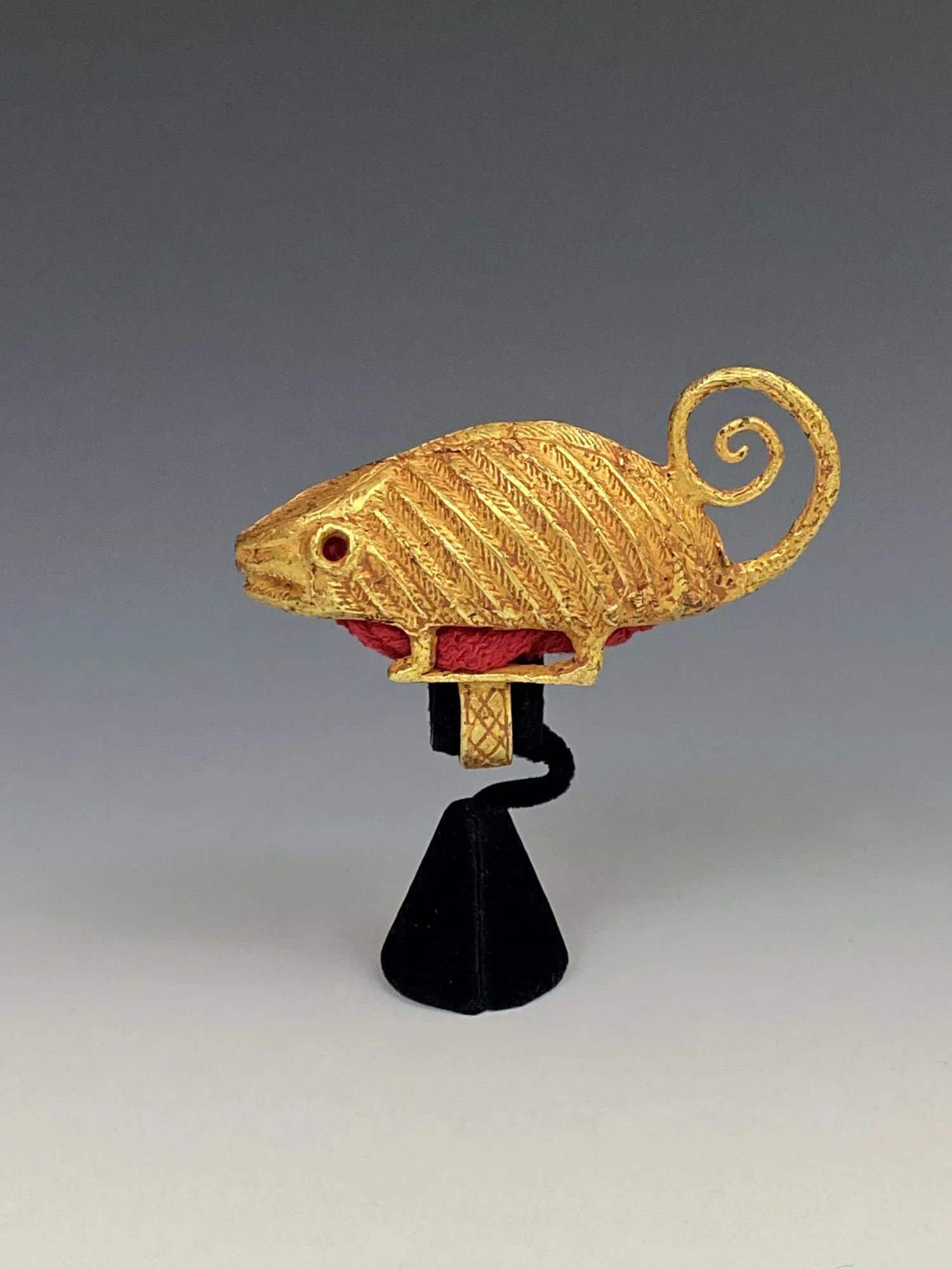 nother colossal Asante gold chief’s ring “mpetea” with the image of a chameleon, 2 3/8” H x 3 3/4” L. Proverb: “The chameleon can only change the color of the clothes he is wearing, not those in his box,” meaning that one can deal only with the immed
