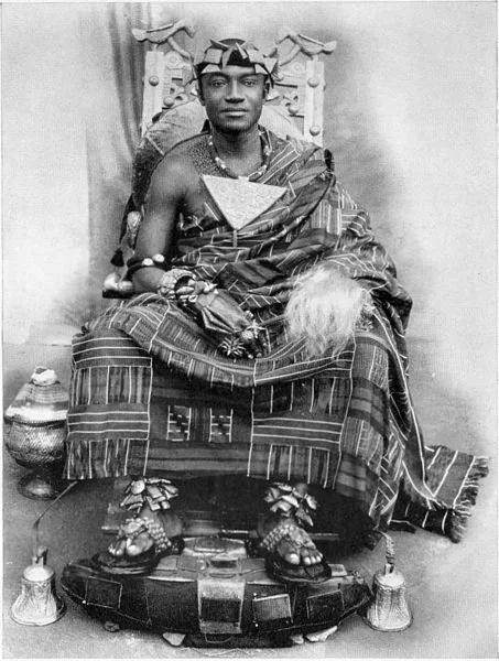 The Asantehene Nana Otumfoe Sir Osai Agyemang Prempeh II (King of Asante) shown here in regalia holding a fly whisk in his left hand.