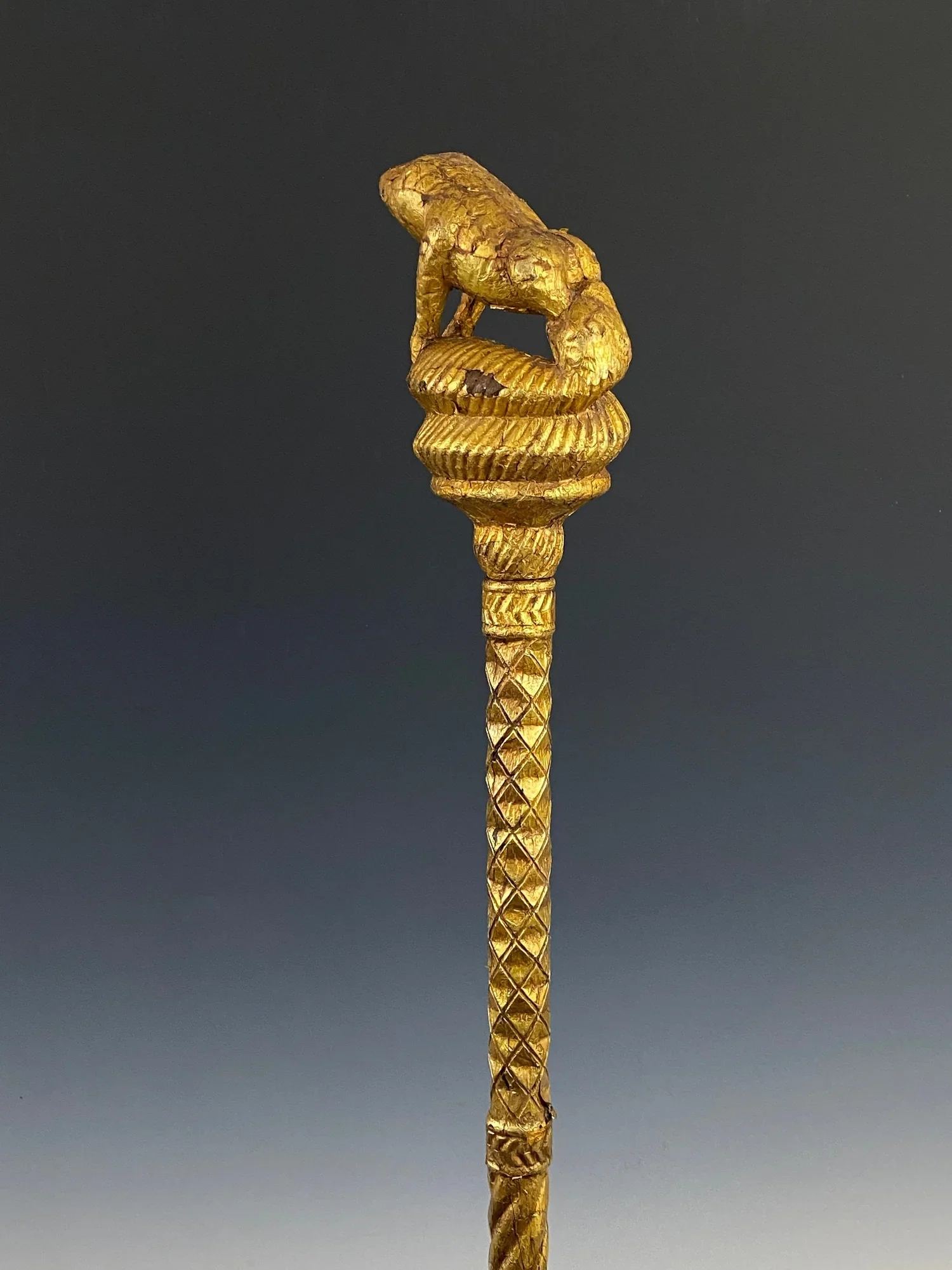 “Okyeame poma” (linguist/orator’s staff). Wood, gold foil. Ghana. 59 inches H. “Magnificent gold-covered staffs like this one are carried by high-ranking officials within the courts of Akan chiefs in an area of West Africa once known as the Gold Coas