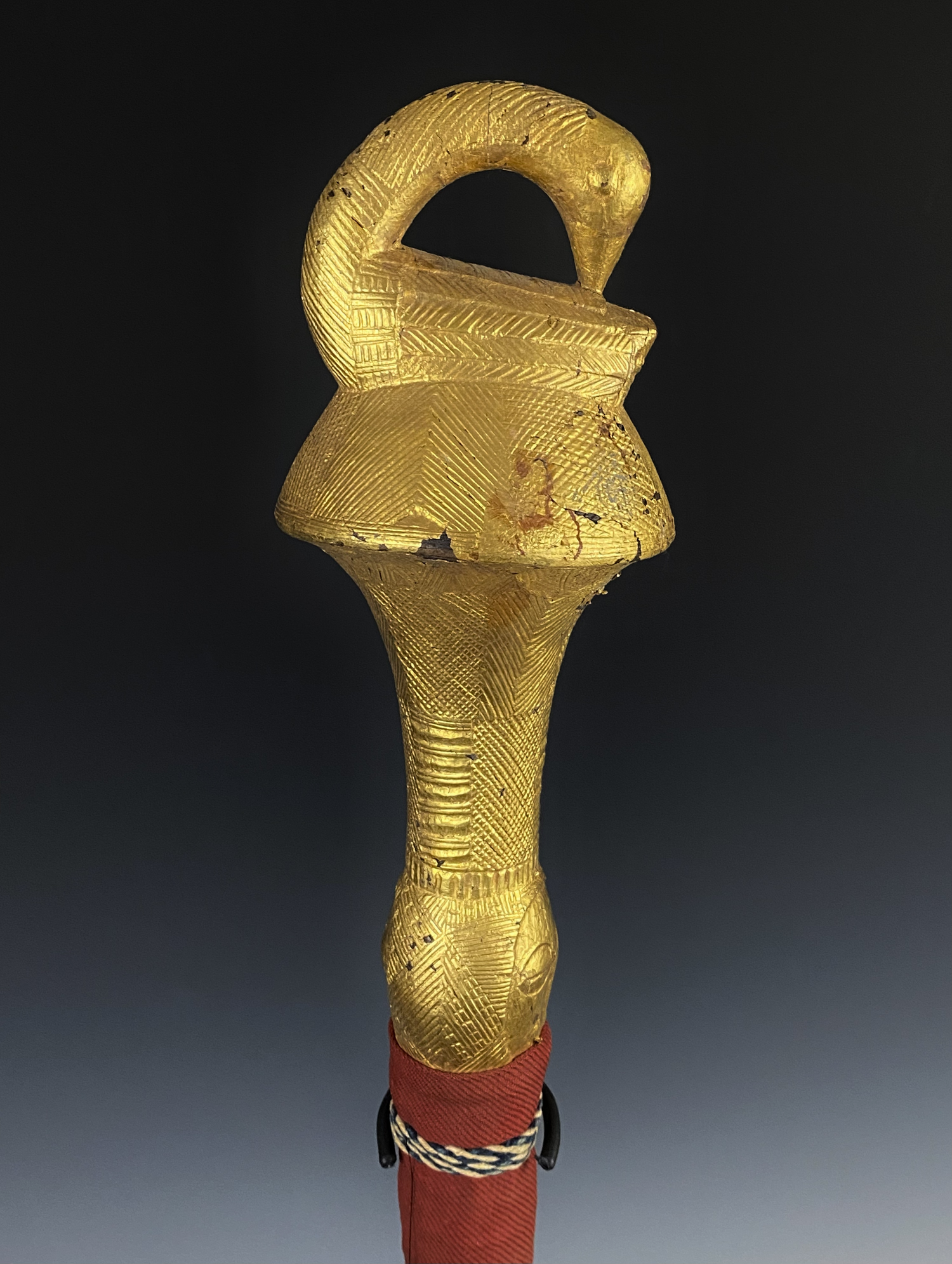 Akan fly whisk, "nandwa blawa", Côte d'Ivoire/ Ghana, Wood, covered with gold foil, horse tail hair, textile. H 46 cm. (112 cm with tail). “One of the most familiar and influential images in all of Akan art is the bird with its head turned toward its