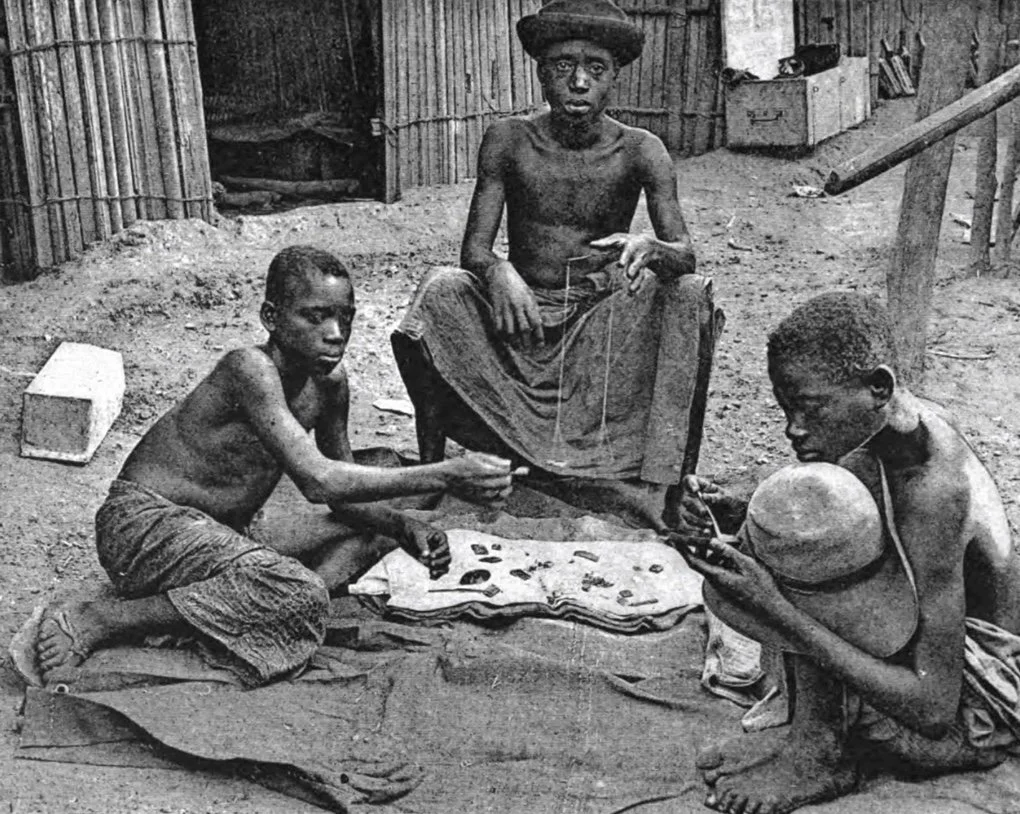Men in the process of weighing gold dust, photographed on the Ivory Coast in 1892. From Marcel Monnier’s France Noire Cote d’Ivoire et Soudan, 1894.