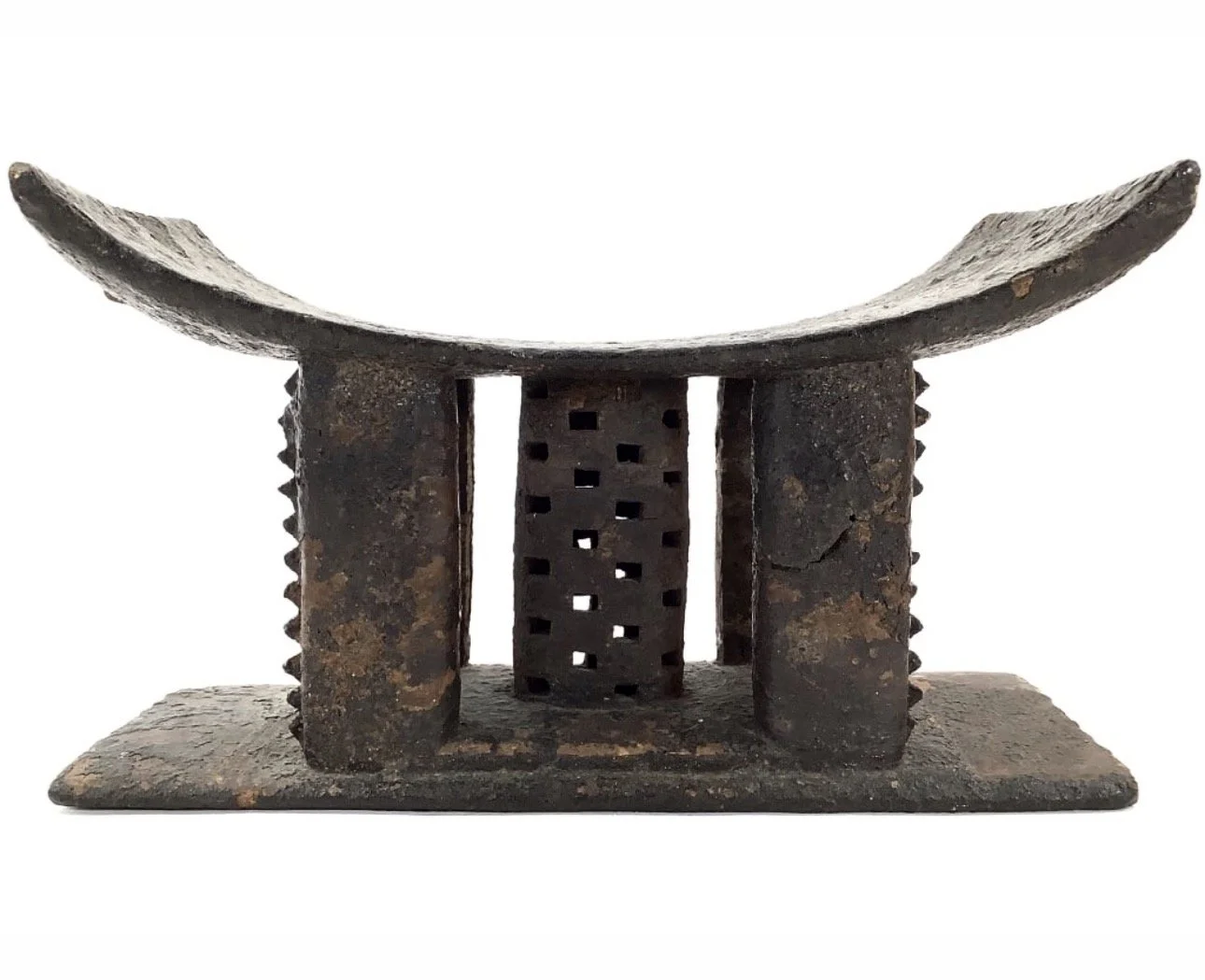 An Asante blackened ancestral shrine stool (nkongua tumtum). 15" L , 8.5' W. Ghana.  This Asante blackened stool is arguably the most powerful ritualistic object within the collection.  Such stools are believed to contain one or multiple ancestral sp