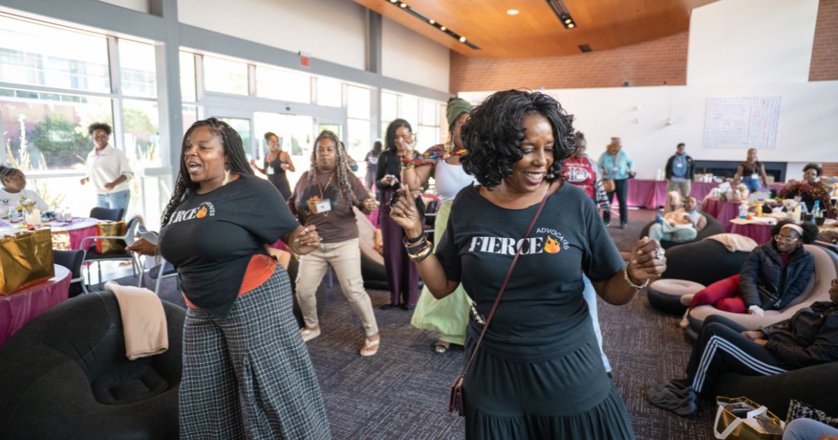 Black women dance together during a movement activity at the 2026 Black Women’s Sanctuary Conference.