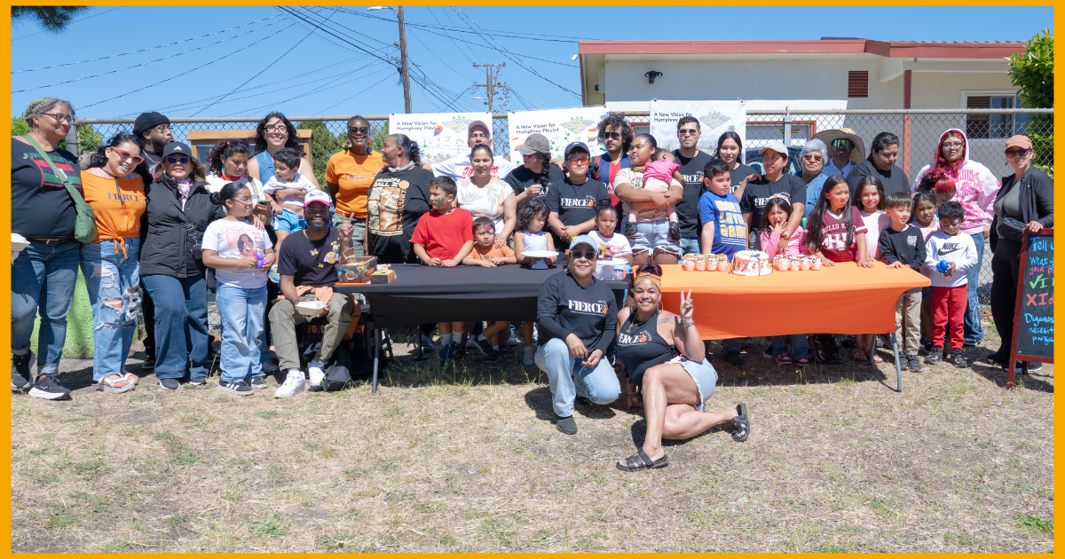 A large group of Humphrey Playlot Summer Block Party attendees, including families, children, resident leaders, and community supporters, pose together at the June 2026 event in Richmond.
