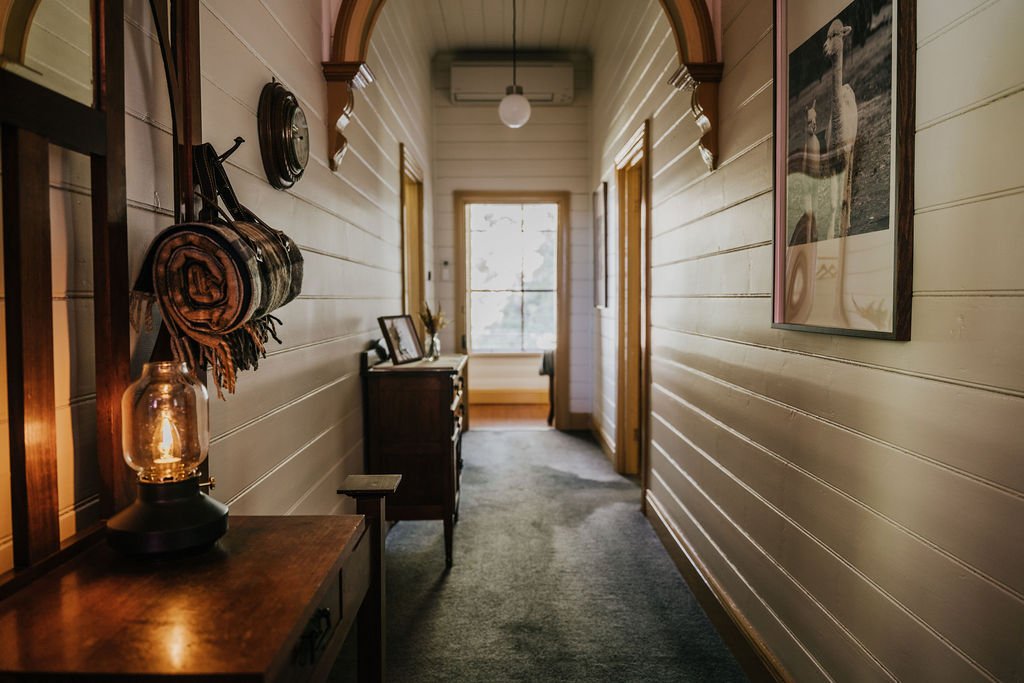 Restored_central_hallway_of_Shepherds_Hill_Cottage_showcasing_original_timber_floorboards.jpg