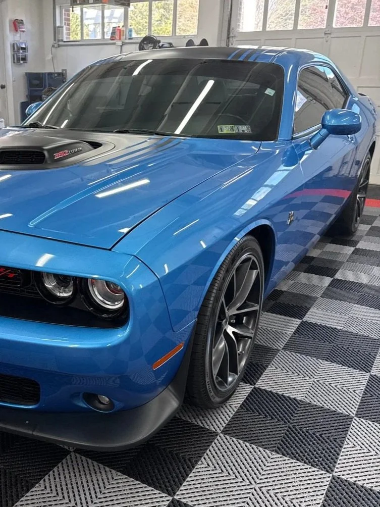 Blue Dodge Challenger exterior detailing after Enhanced package with paint protection and trim protection