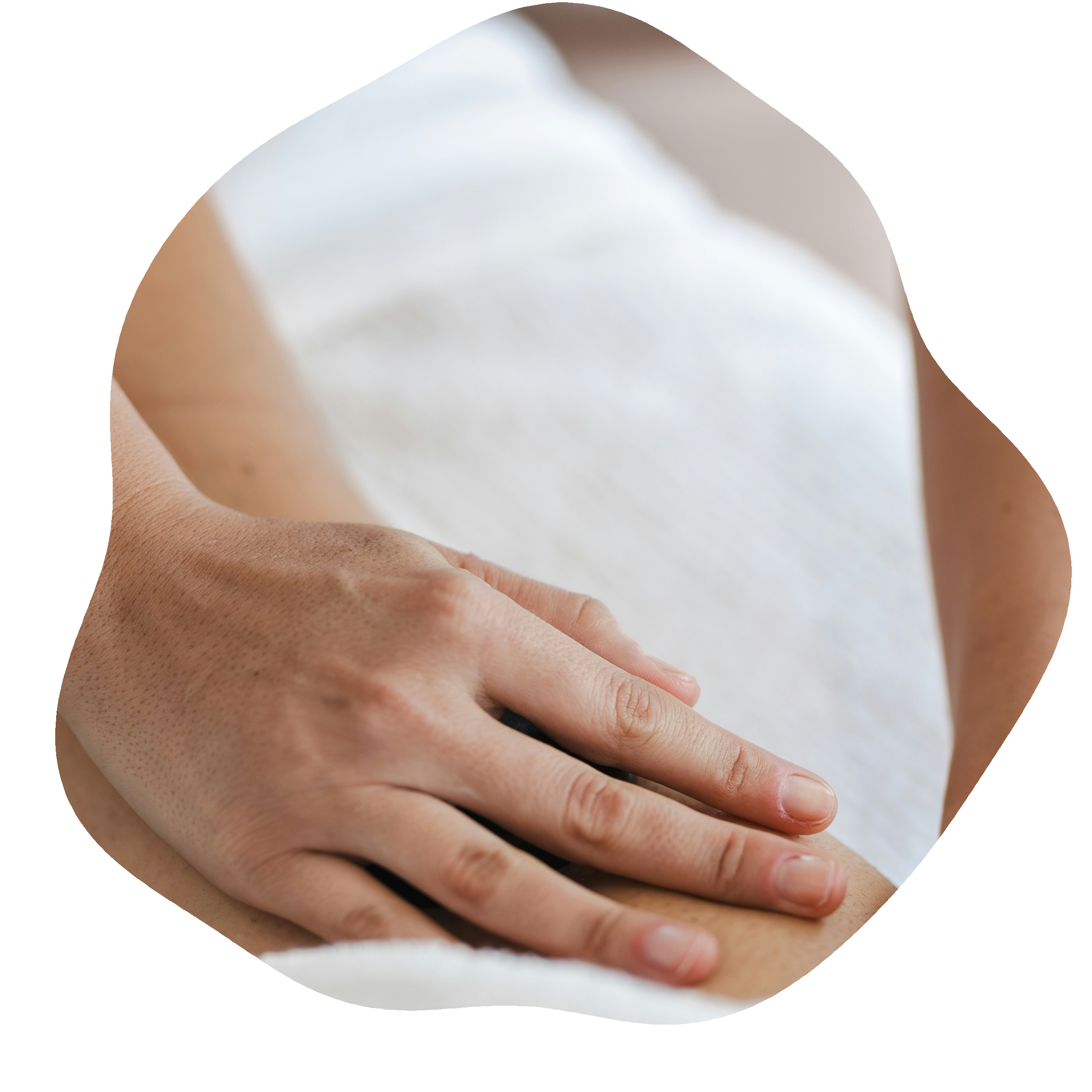 A close-up of a person’s hand resting on a surface with light skin tone and neatly trimmed nails.