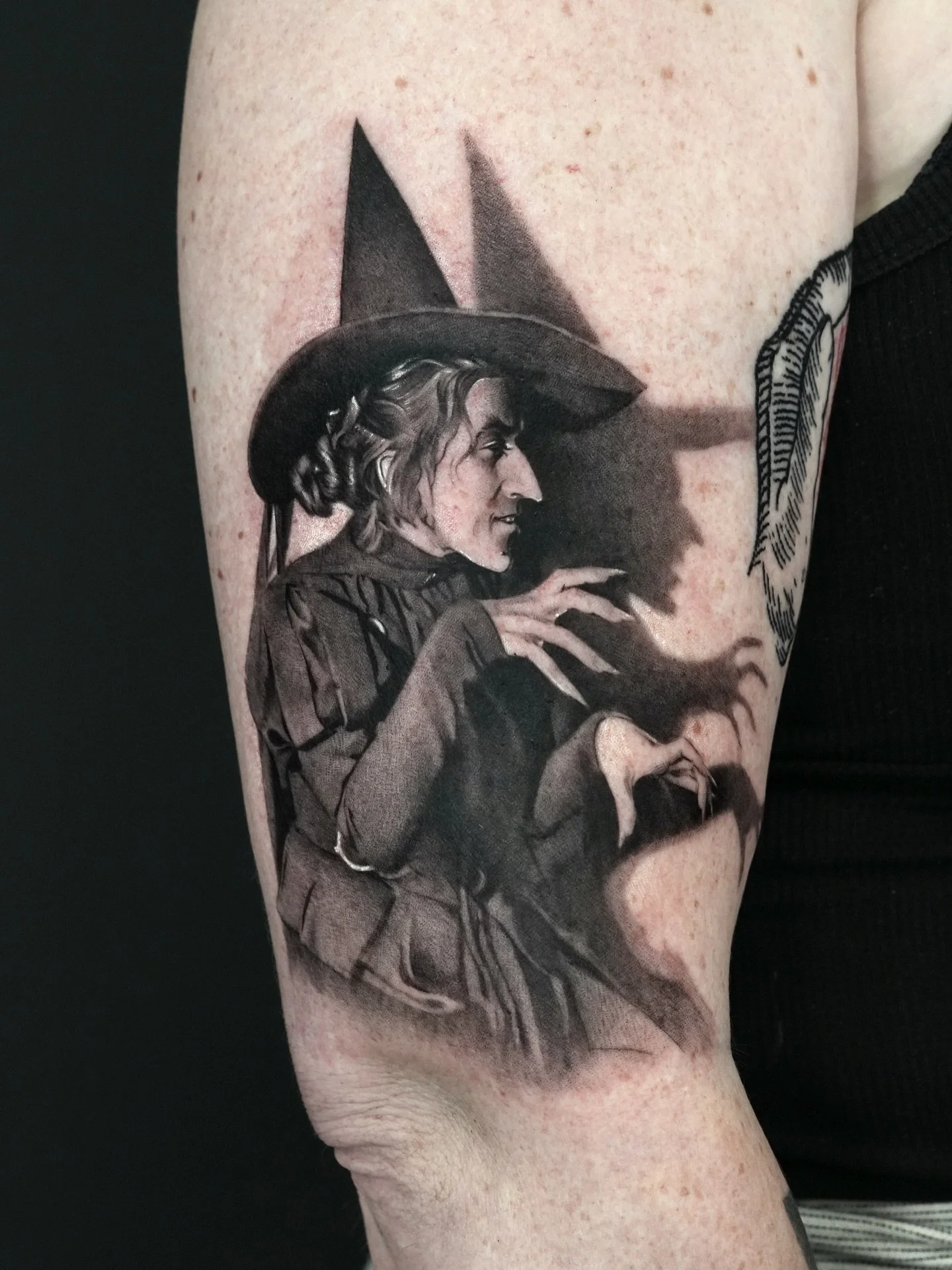 I love that shadow 🖤🪄

Inquiry link is in bio 👆
Done at @dot.creativegroup, message me to guest with us!

#tattoo #wickedwitchofthewest #oz #witchtattoo #photorealism #microrealism #detailedtattoo #portraittattoo #nyc #nyctattoo #goldy #inked #ski