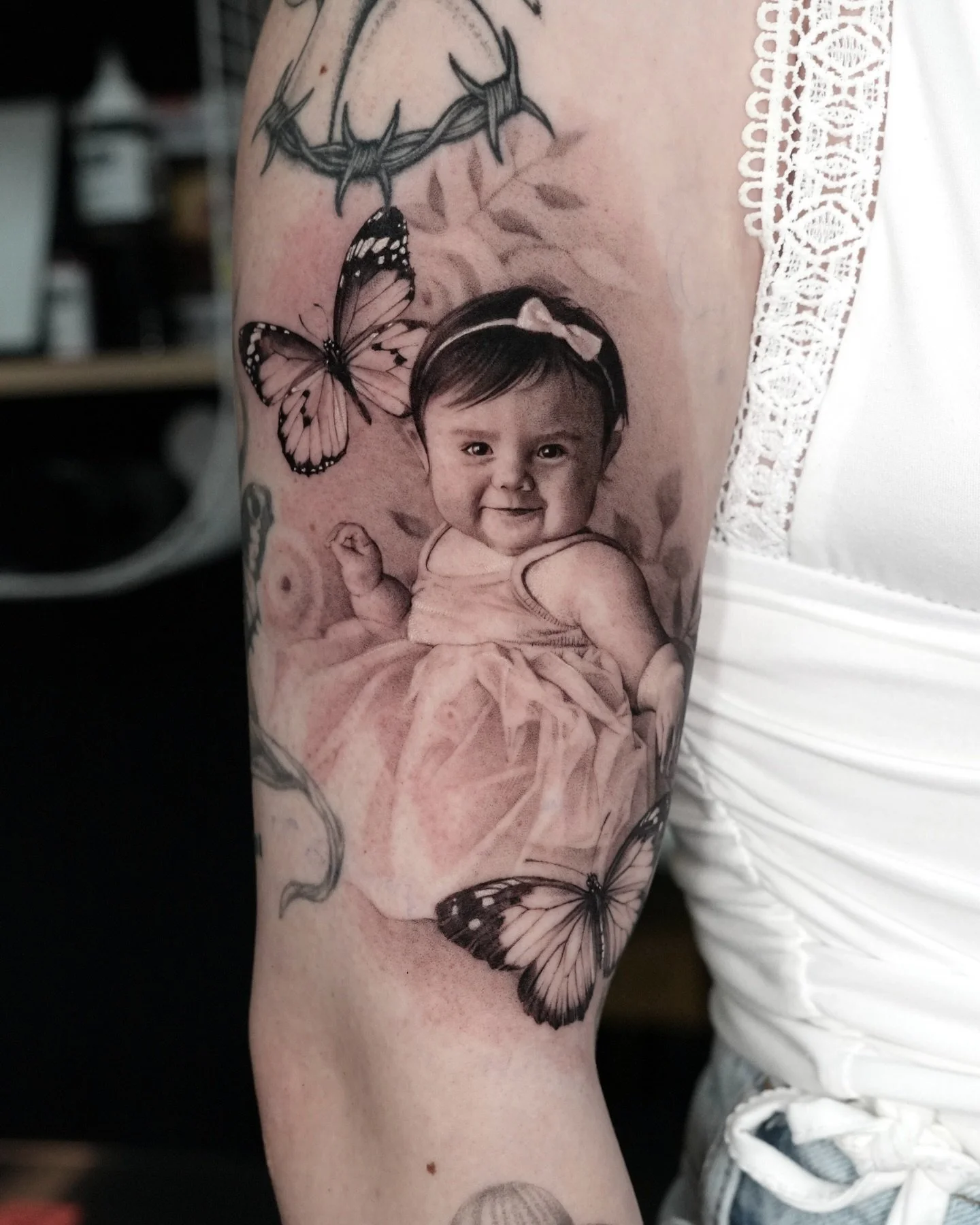 Mommy&rsquo;s little princess 🦋🦋
Always an honor to work with fellow tattoo artists 🫶
Done during my guest spot at @goldenirisboulder 

Books open, inquiry link in in bio

#tattoo #portraittattoo #girltattoo #babyportrait #butterflytattoo