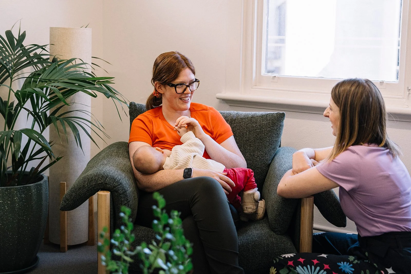 Our lactation consultant and a client breastfeeding