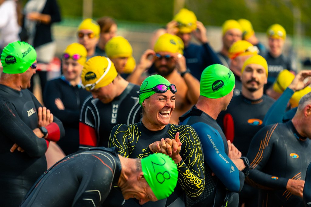 Laura smiling on Brighton beach before a Swim Brighton race
