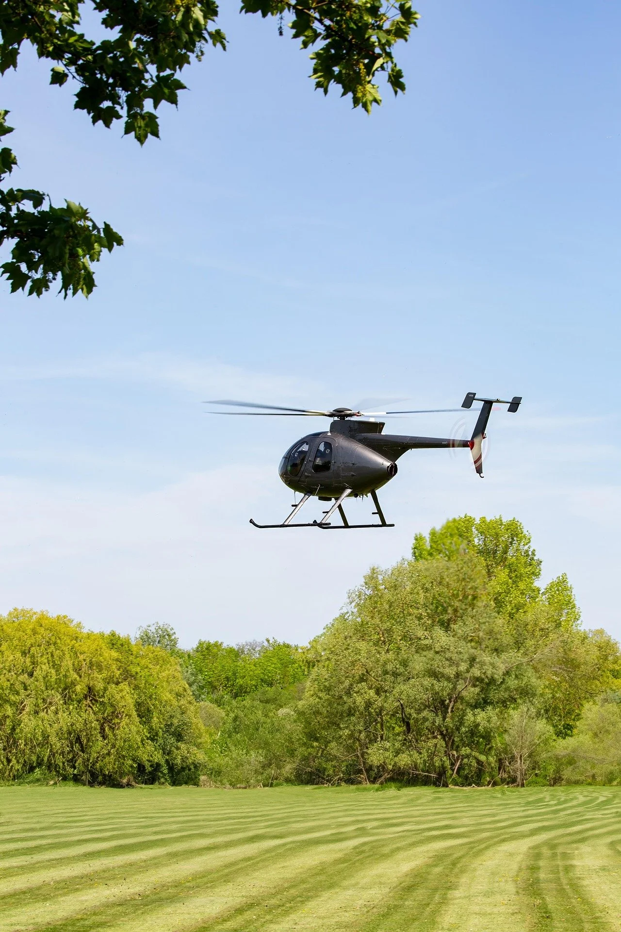 Helicopter over perfect landscaped grass
