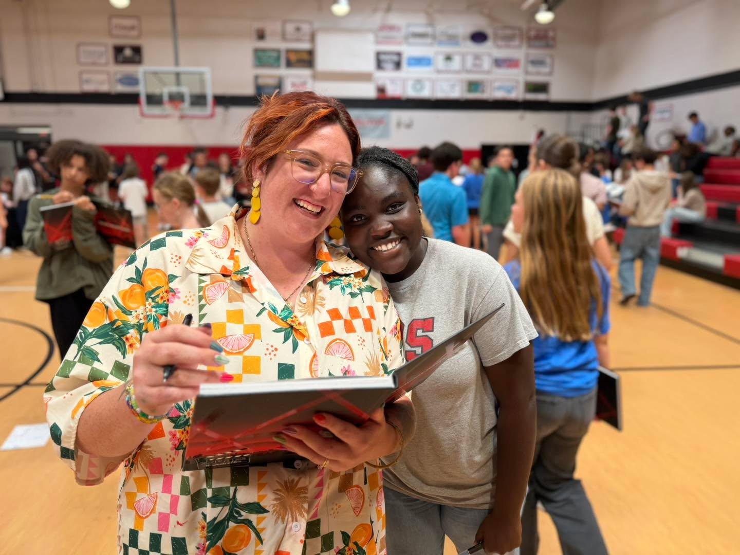 Yearbooks are officially here! Today, Middle and Upper School students gathered in the gym to flip through pages filled with memories from the year and spend time signing each other&rsquo;s books. From inside jokes and heartfelt notes to favorite mom