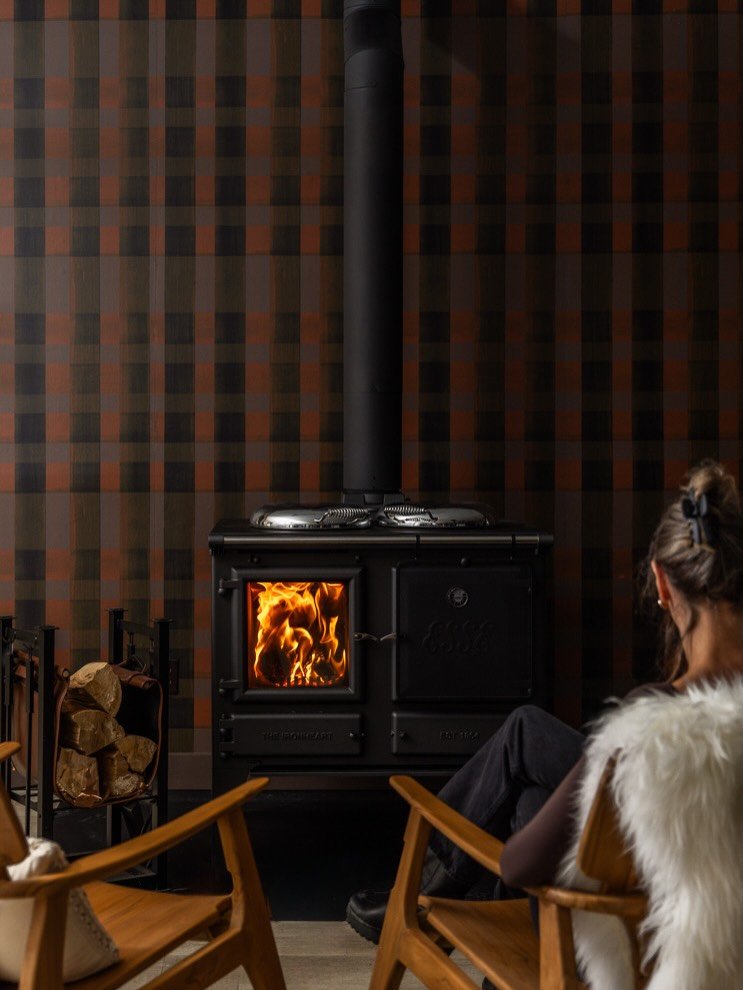 BOX CAR from our PASSENGER COLLECTION featured @emberleynl showroom in St John&rsquo;s NL. A large-scale hand-painted gingham with a chestnut undertone. Pairs well with the @esse1854 Iron Heart Woodfire Cook Stove.