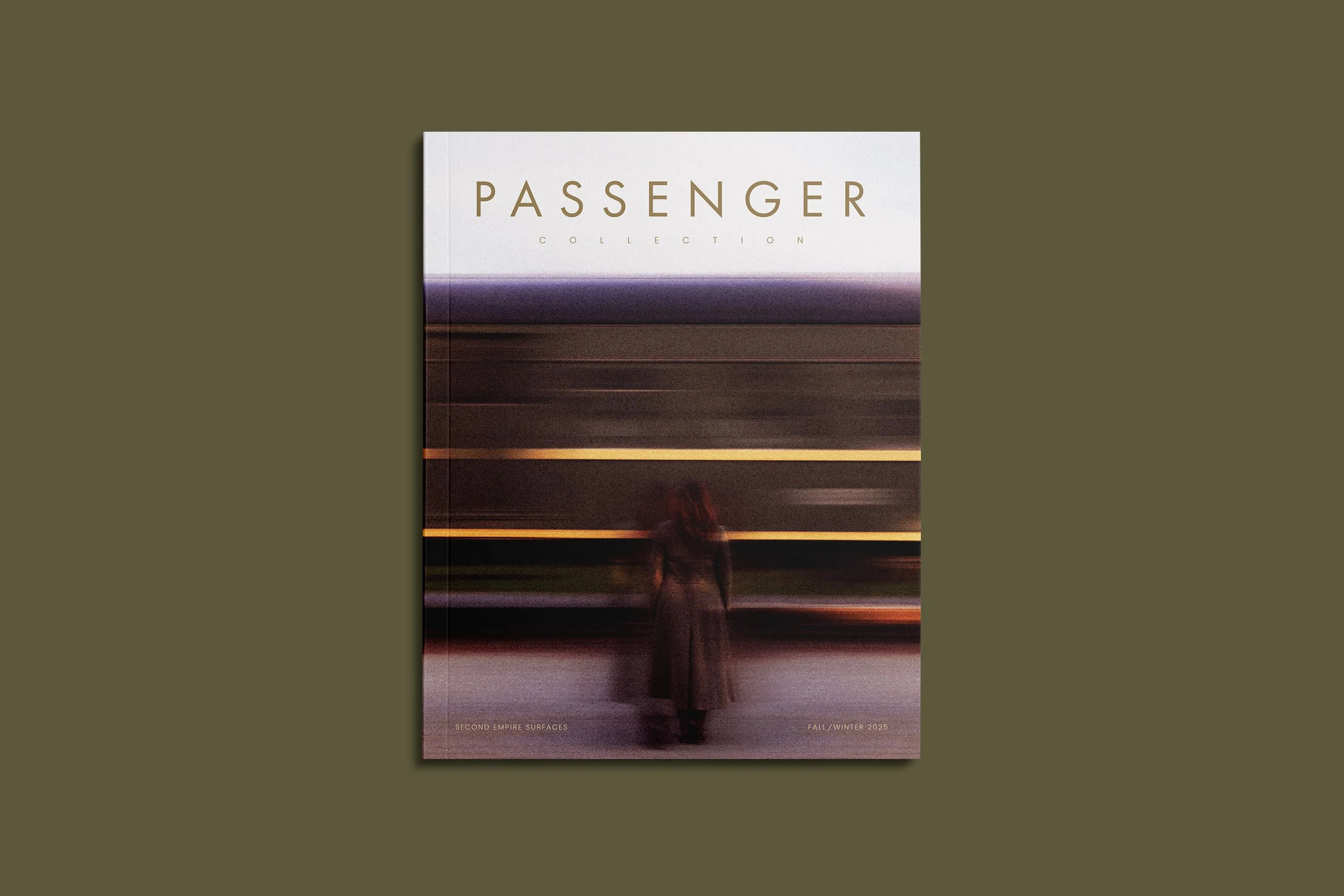 Magazine titled 'Passenger Collection' with a blurry cover image of a person standing in front of a blurred train, with small text at the bottom indicating 'Second Empire Surfaces' and 'Fall/Winter 2025'.