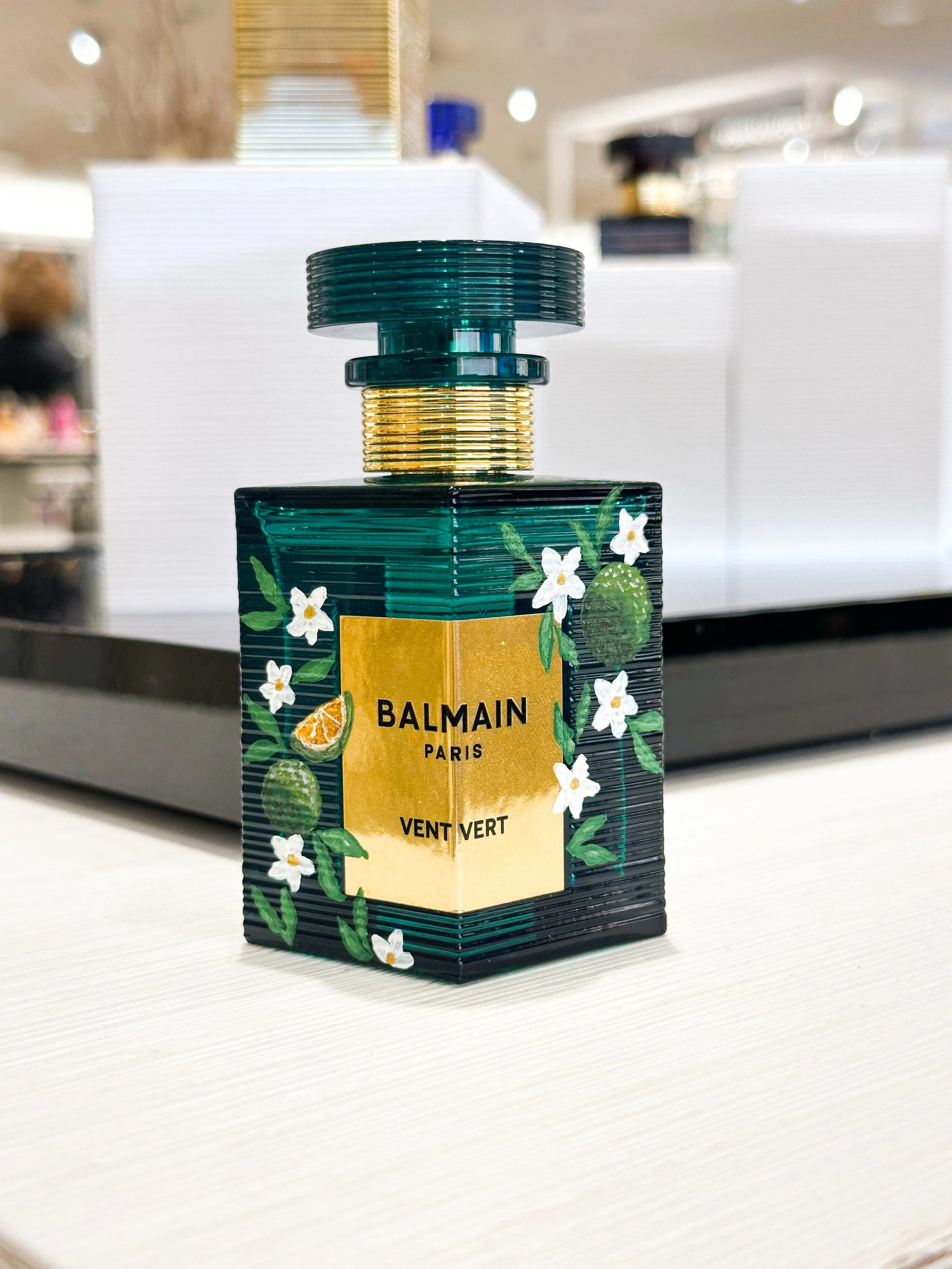 Custom live bottle painting for Balmain fragrances in Orange County ink and innuendos activation 
