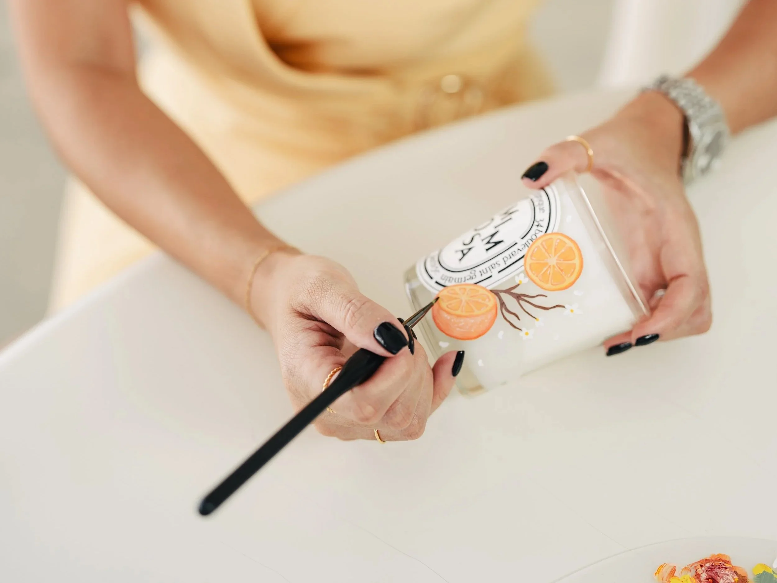 hand bottle painting of Diptique candle for personalized gifting in Orange County by ink and innuendos
