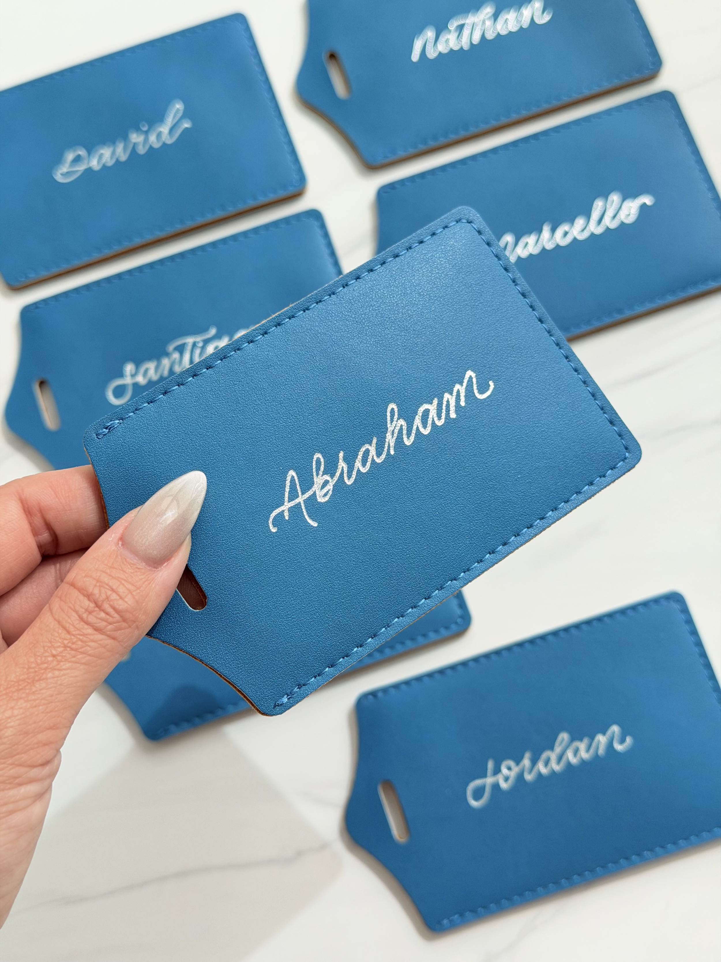 Personalized hot foiled in silver leather luggage tags for private event by ink and innuendos