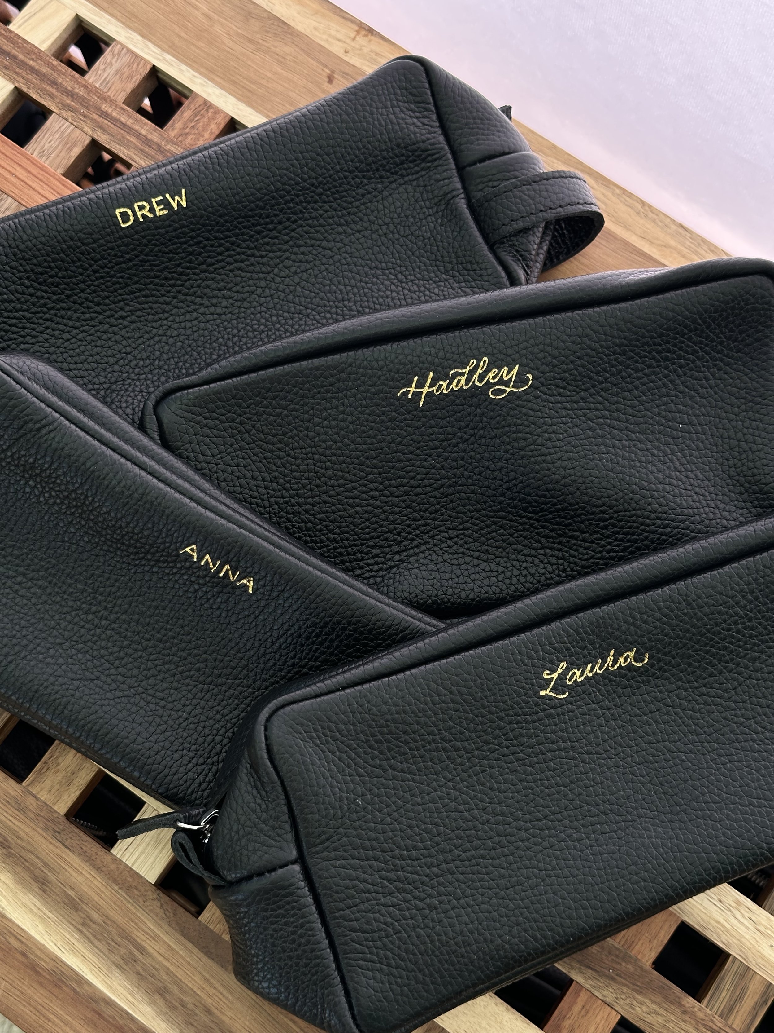 Personalized live hot foiling on toiletry Dopp kit bags in Huntington Beach Los Angeles for Future Proof Festival activation 