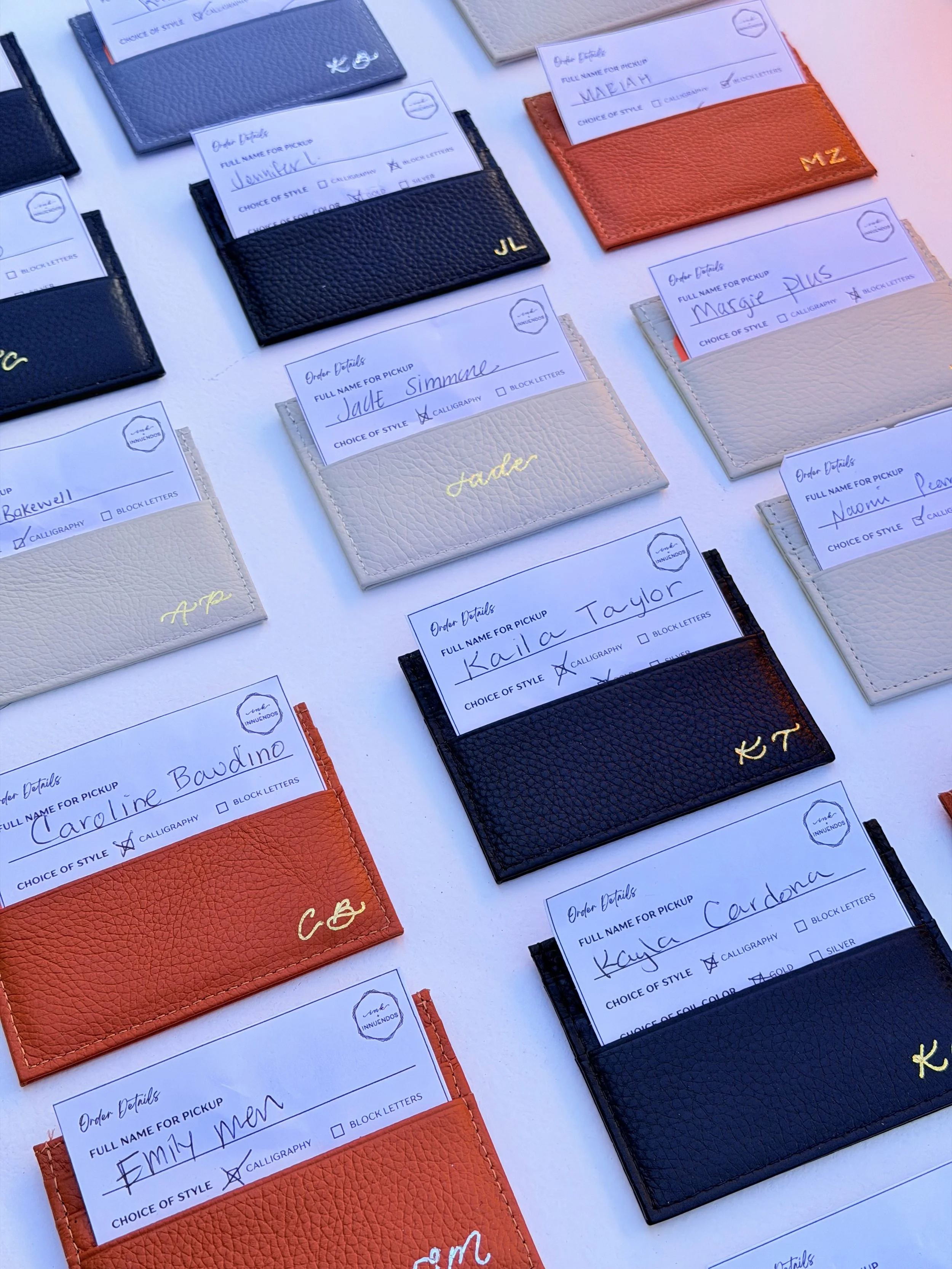 Live hot foiling on leather card holders in Los Angeles 
