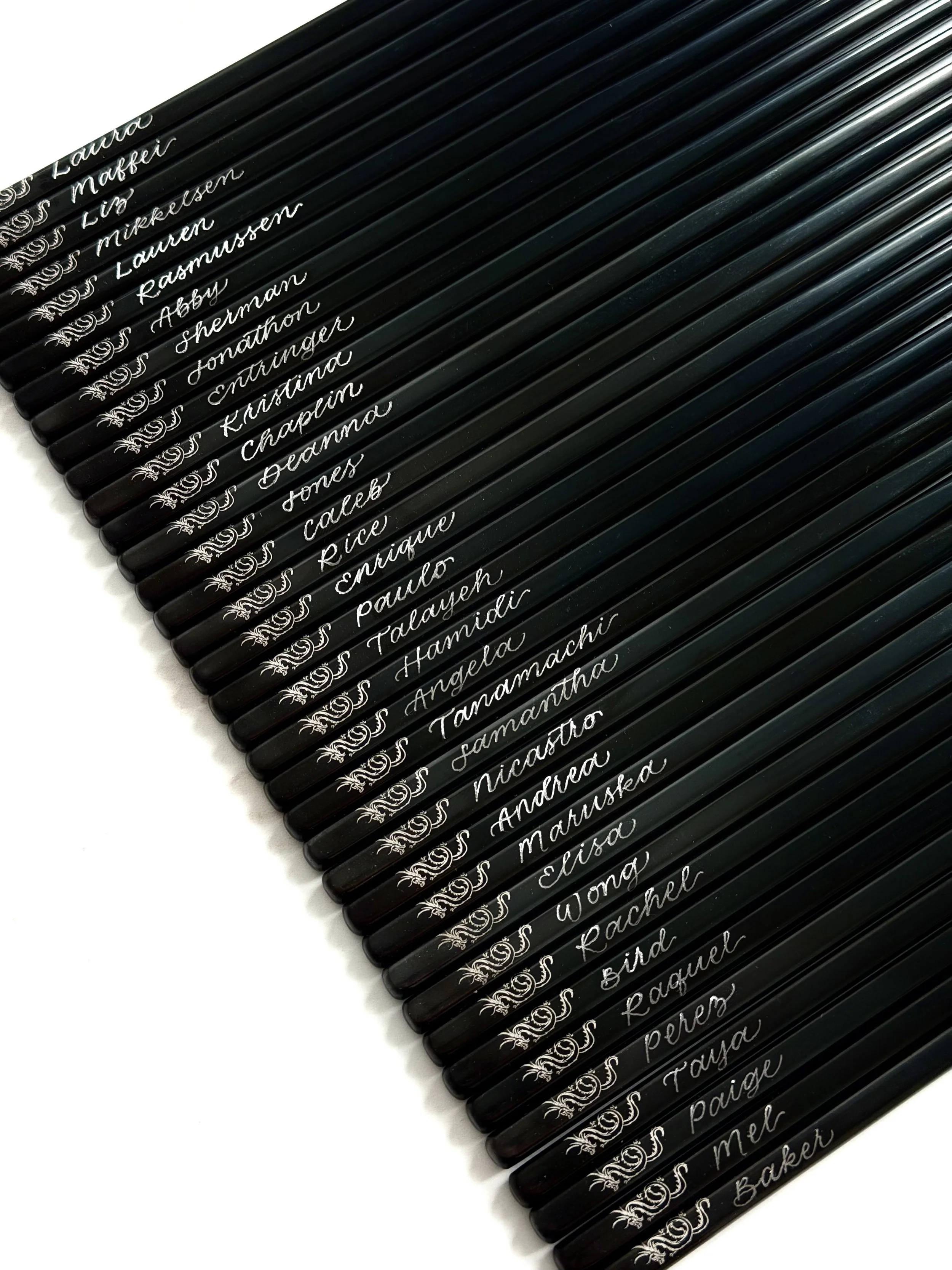 Personalized hand engraved metal chopsticks as place cards for private corporate event in Orange County by Ink and Innuendos