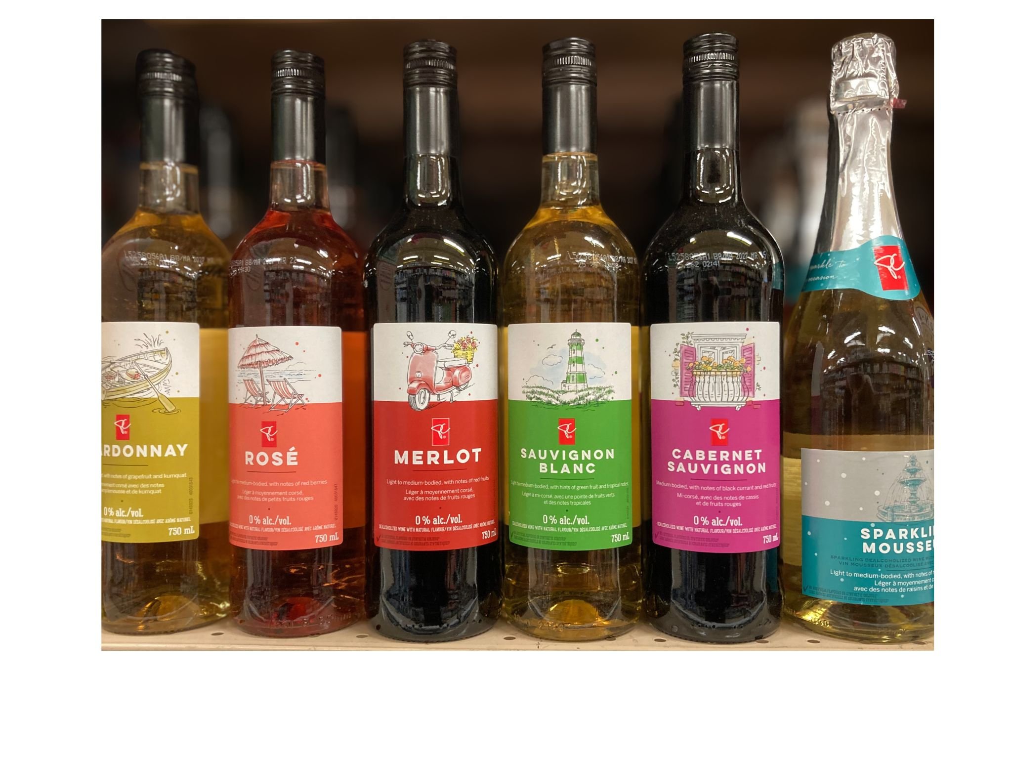 Display of six wine bottles labeled PC 0% alc./vol., including chardonnay, rosé, merlot, sauvignon blanc, cabernet sauvignon, and sparkling wine.
