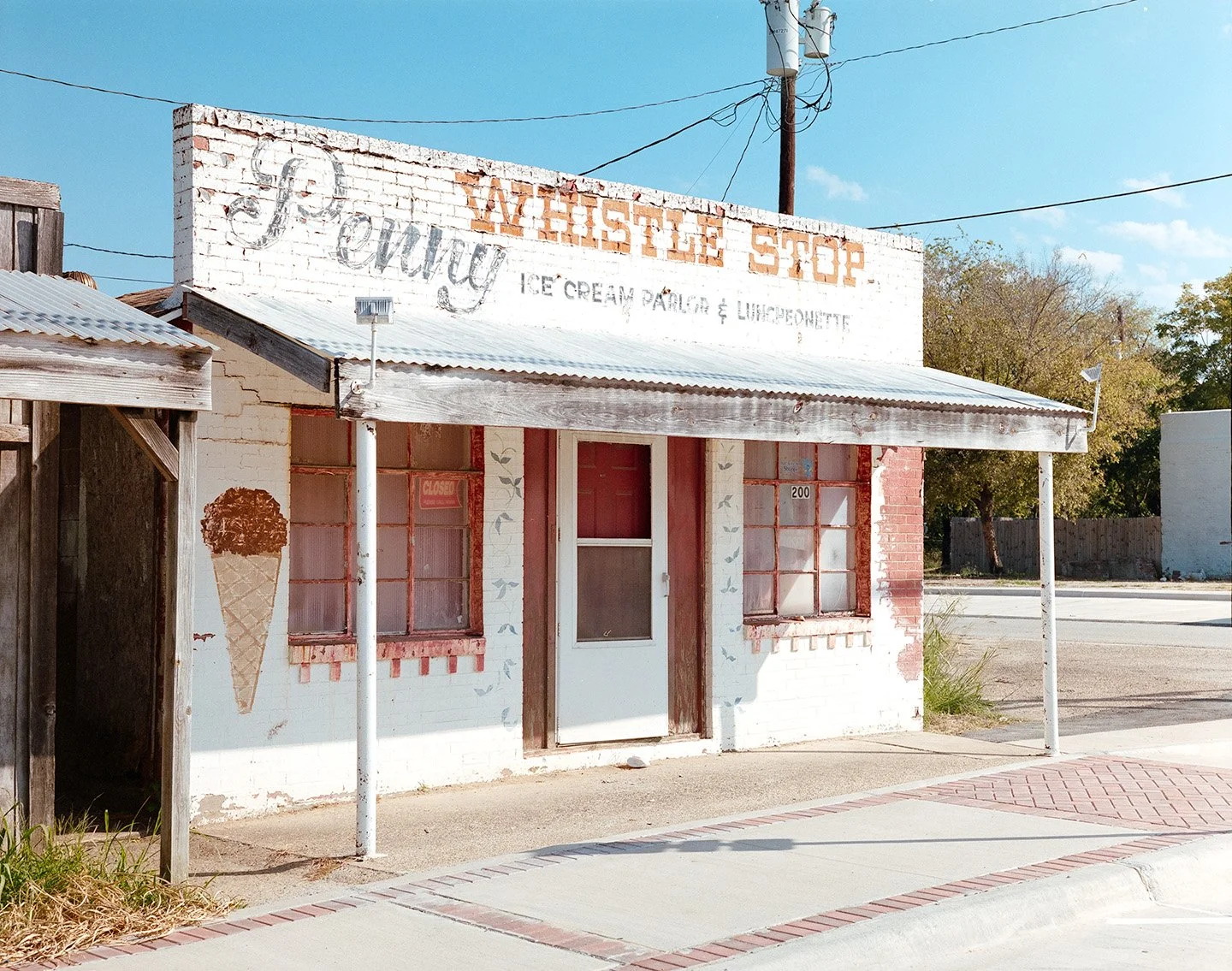 Abandoned Penny Whistle Stop, ice cream shop. medium format film photography, small town art.