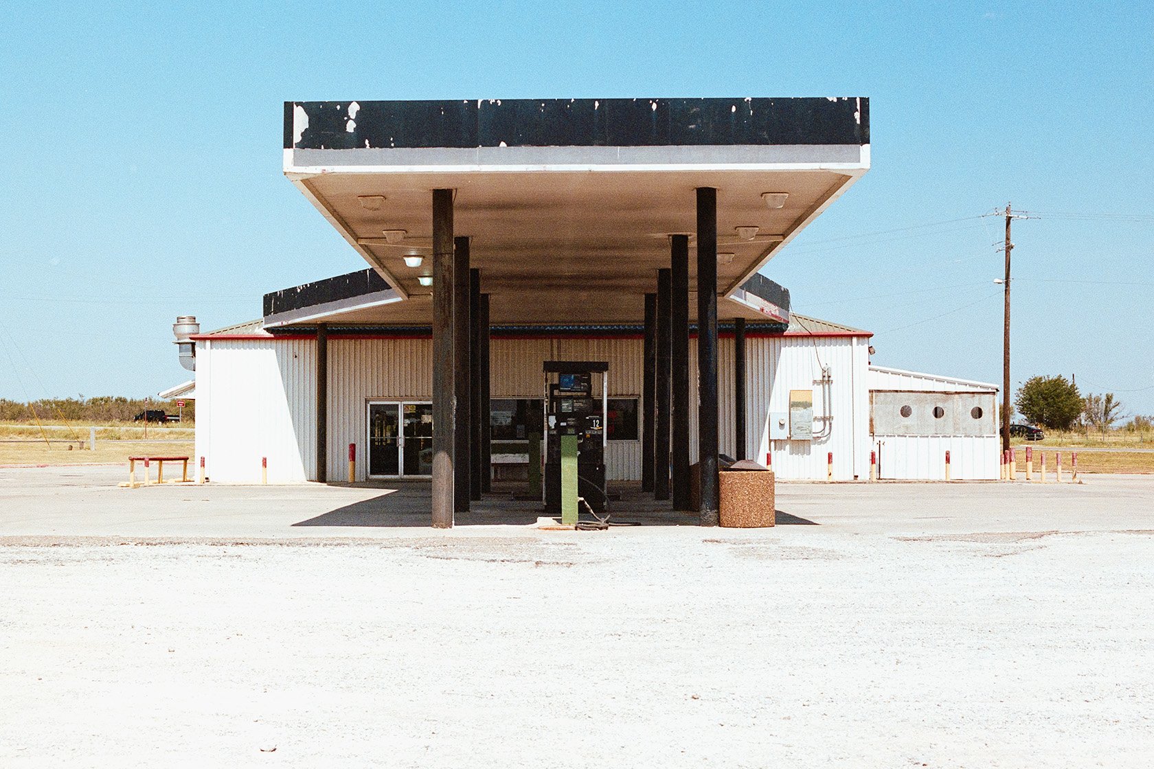 Nostalgic gas station in the west Texas desert with colorful blue sky. West Texas fine art photography.